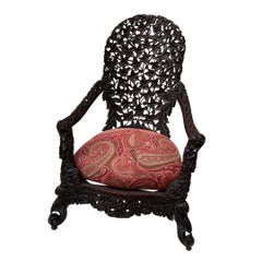 Anglo-Indian Burmese Victorian armchair, made of precious wood and Etro fabric.