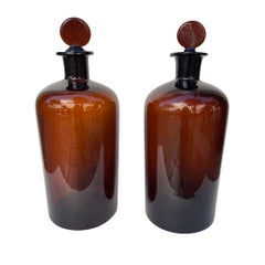 Pair of Art Nouveau amber glass albarellos with glass stoppers