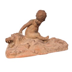 Escultura de terracota «Putto sobre piel de león», de Léon Dufrène (Francia). Firmada.