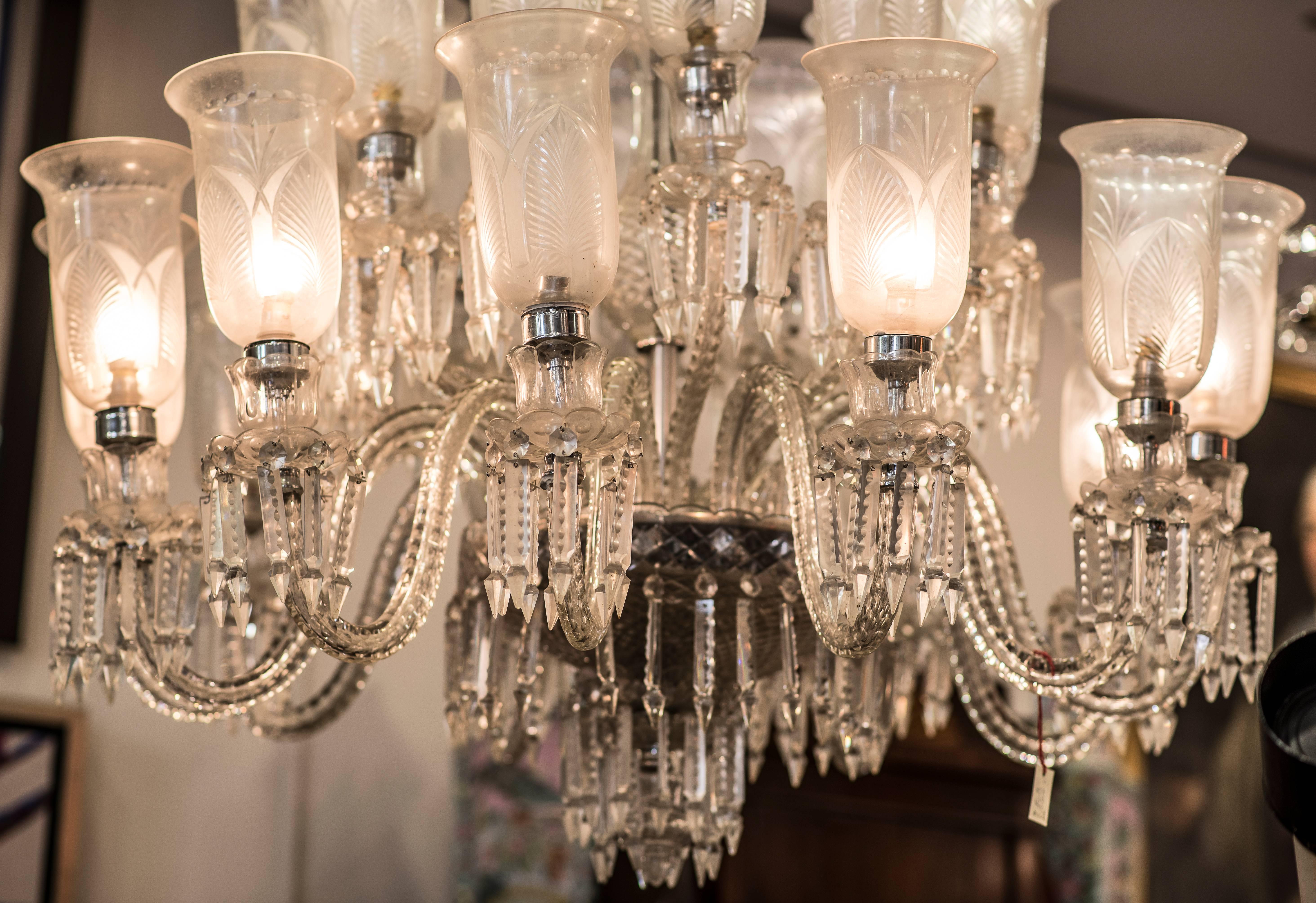 Impressive and unusual crystal carved chandelier in the style of Louis XV. With 24 lights. French crystal with floral design