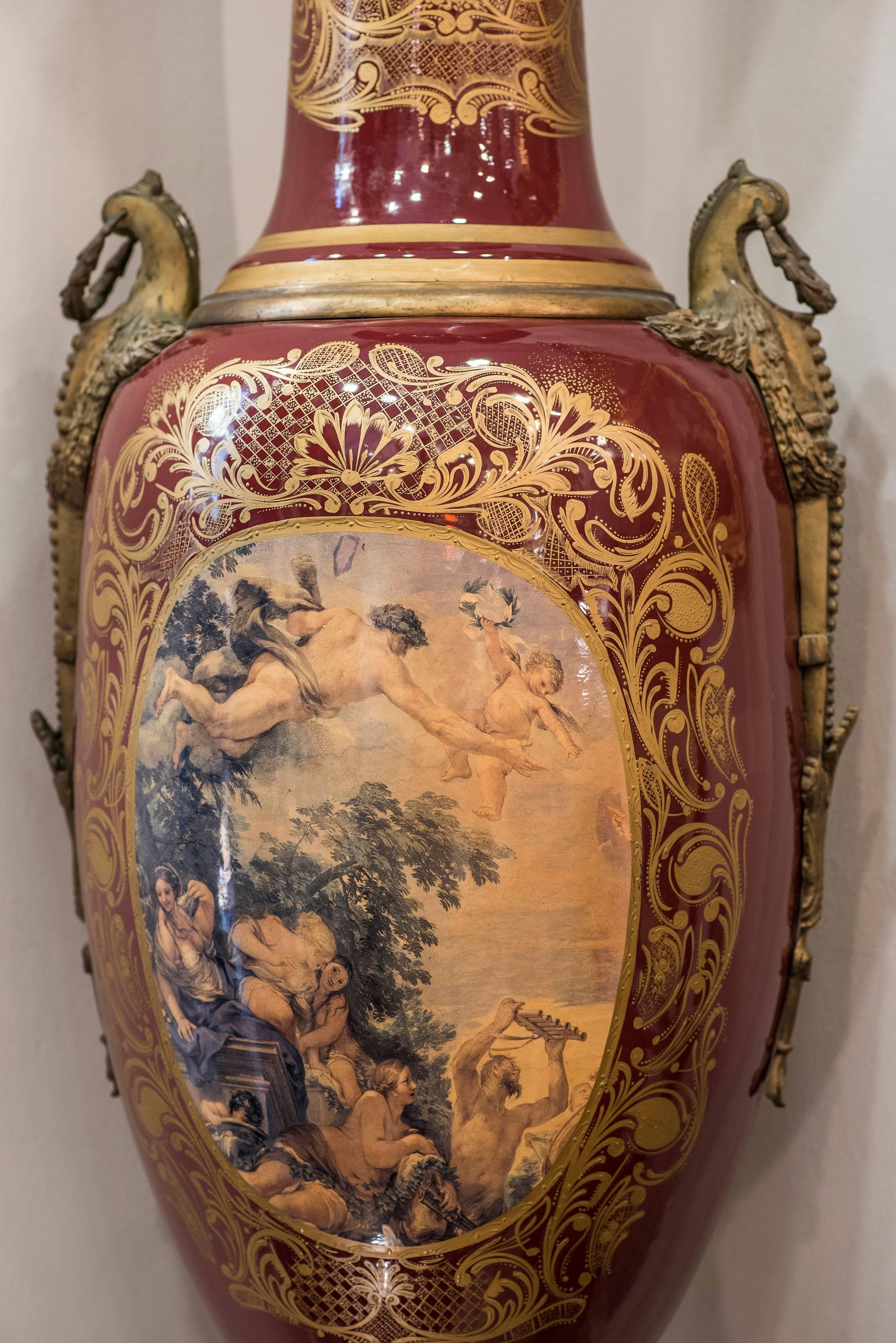 An extraordinary pair of porcelain vases, manufacture “Le Vieux Paris”, with scenes on both sides in an exceptional burgundy color.