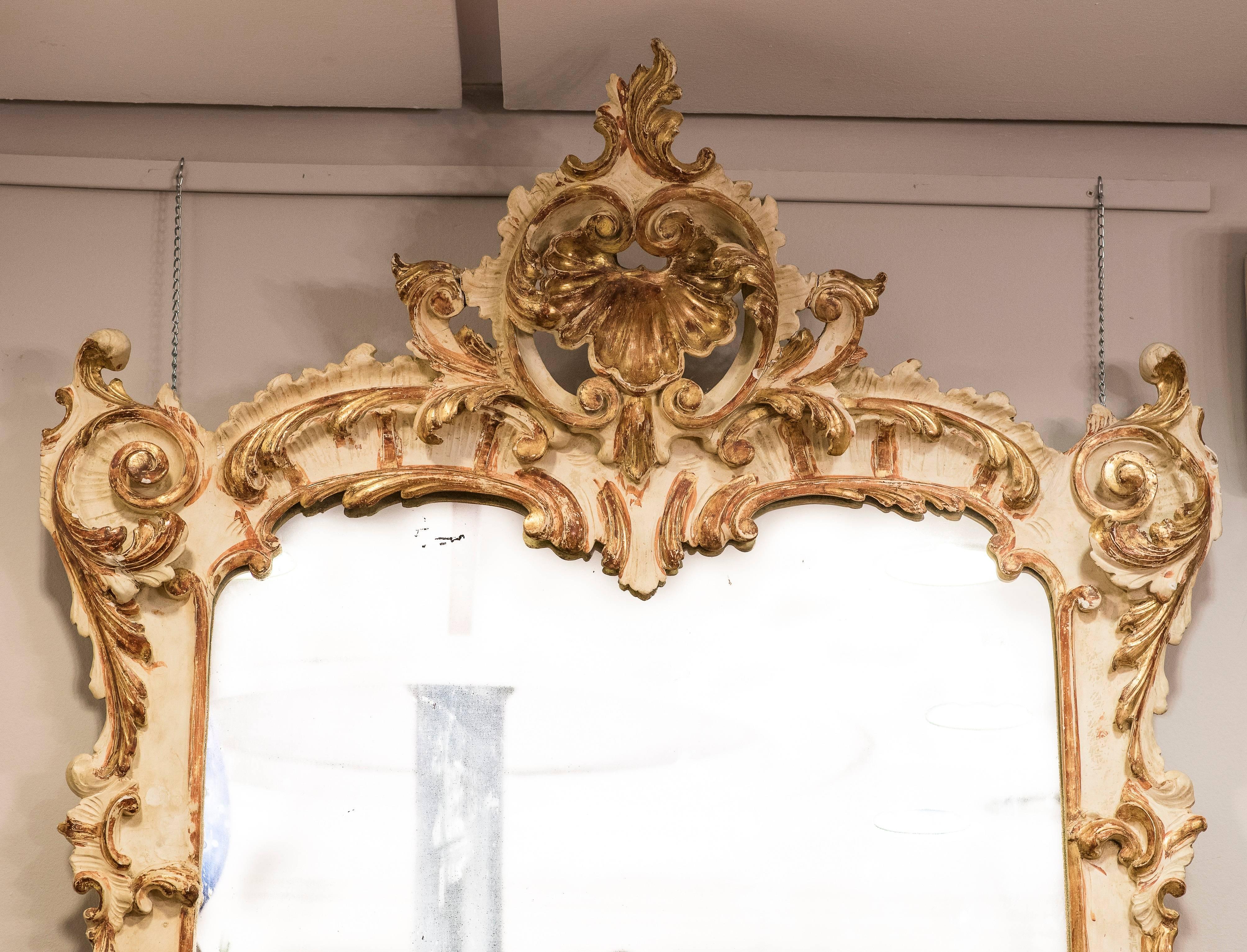 Rare and huge pair of Venetian mirrors in painted and golden carved wood.
From a very important private Italian collection in a Palace.