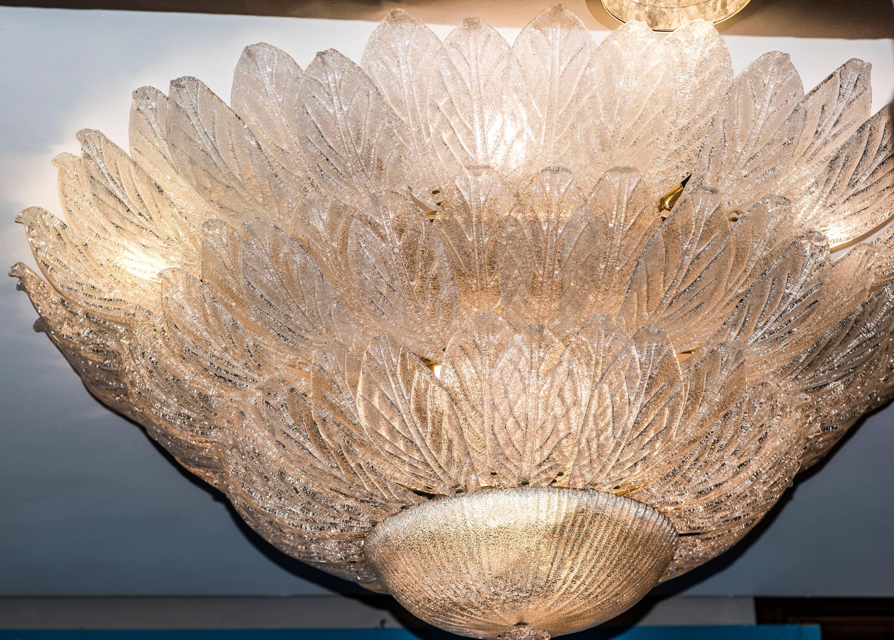 A one of a kind huge Murano glass chandelier, design by Tosso
& Barovier, circa 1970, SXX. In a perfect condition with two
spare glass leaves. All is full of glass leaves and golden brass.It comes from a  well-known 
luxury hotel in Naples ( Italy)