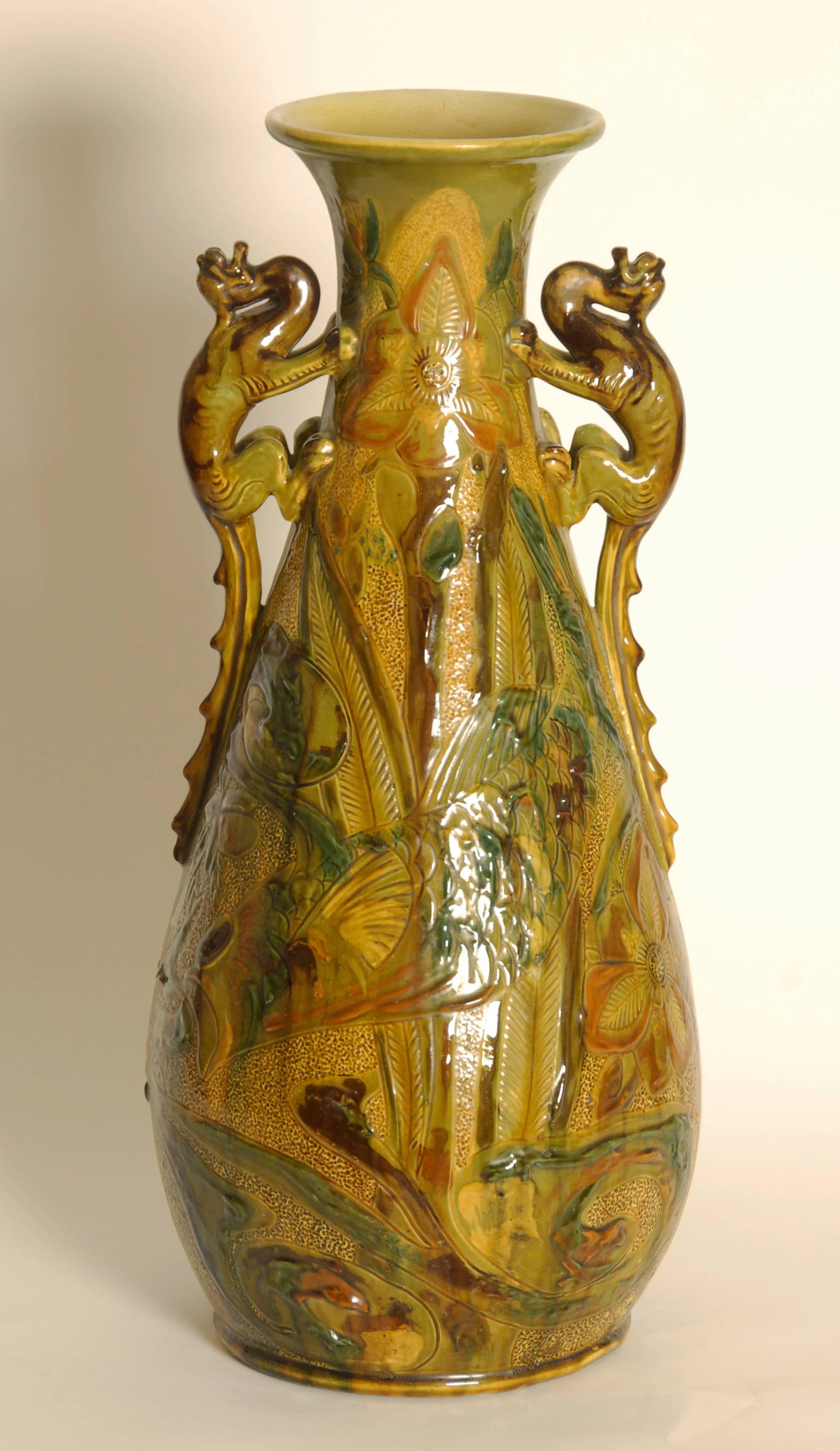 Large and impressive early 20th century Art Nouveau / Arts & Crafts lizard handle vase by C.H Brannam, designed by James Dewdney.
Signed and dated 1907.
Depicting naturalistic scenes of fish, reeds and flowers.
Price includes free shipping.