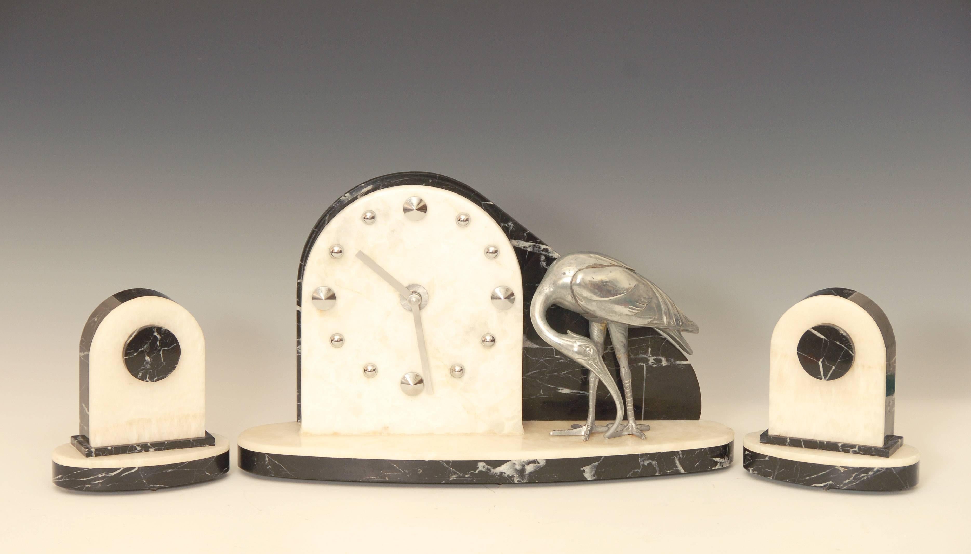 Fabulous Art Deco marble clock with white metal stork and matching marble garnitures.
Converted to battery power so keeps perfect time and does not need to be wound.