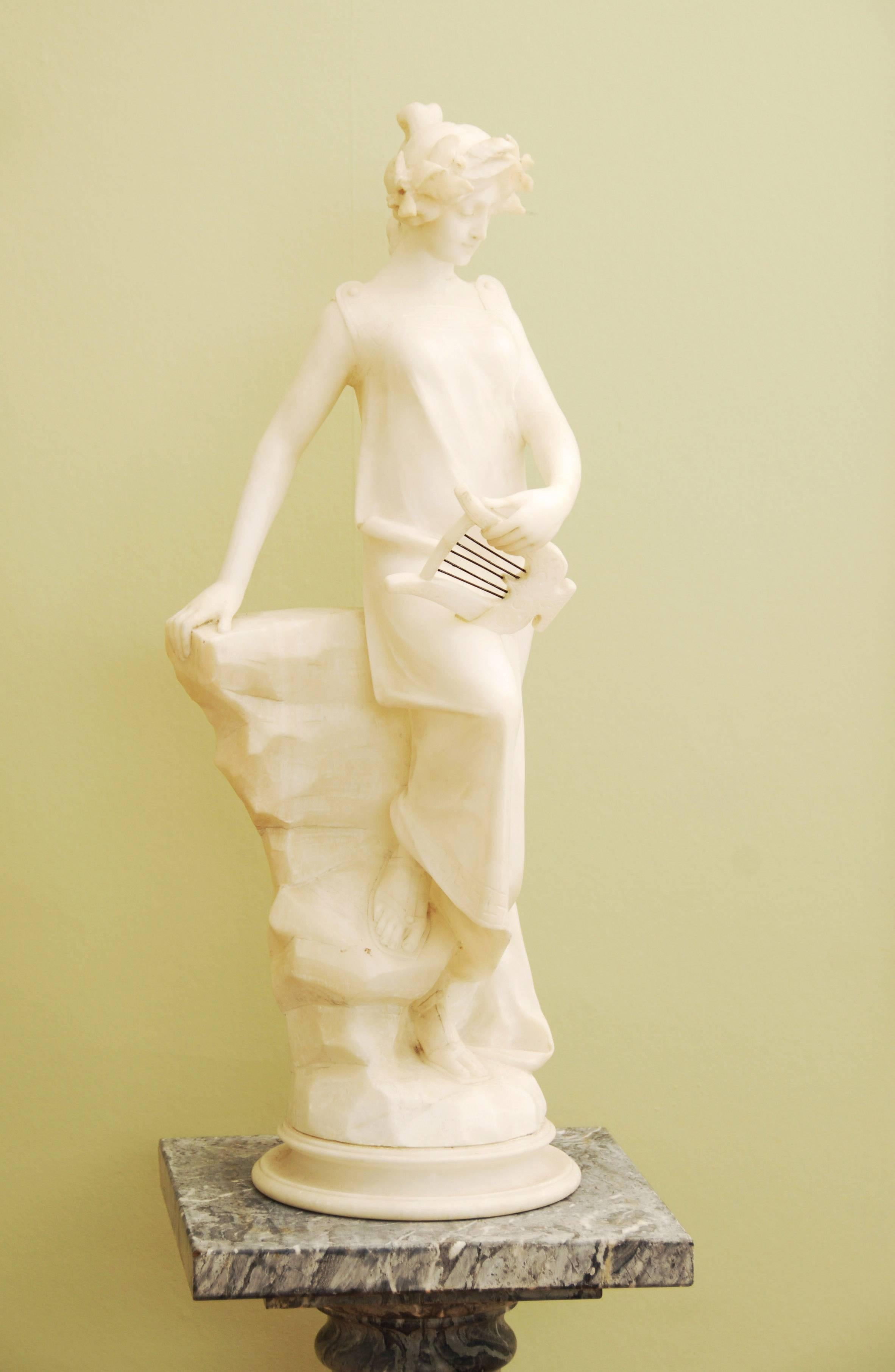 Beautiful Italian carved alabaster Art Nouveau statue of a muse holding a lyre signed by Adolfi Luchini
carved, circa 1910.
 