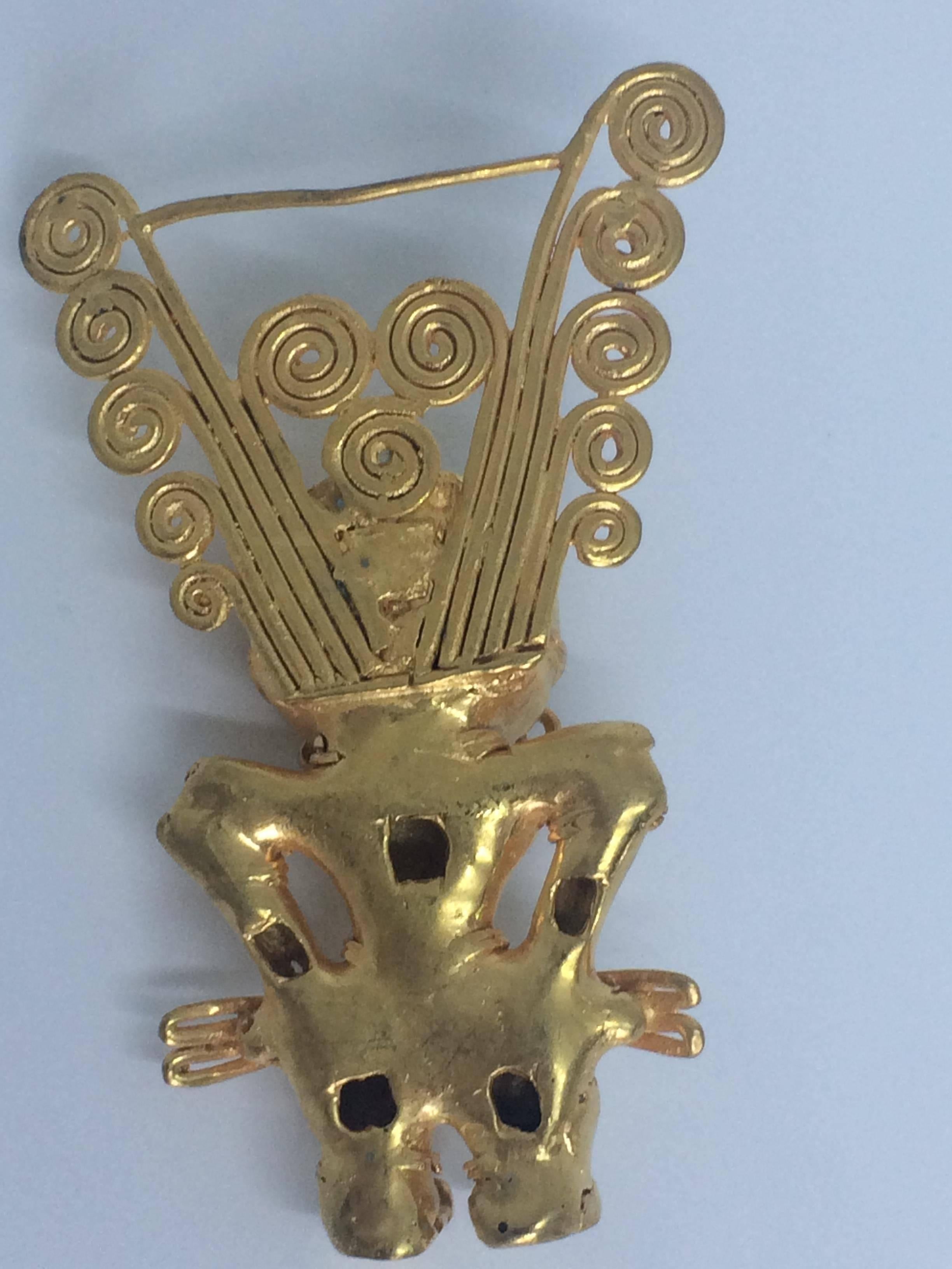 This Cacique Tairona pendant is a Pre Columbian lost wax casting in a low carat gold depicting a chieftain or a 