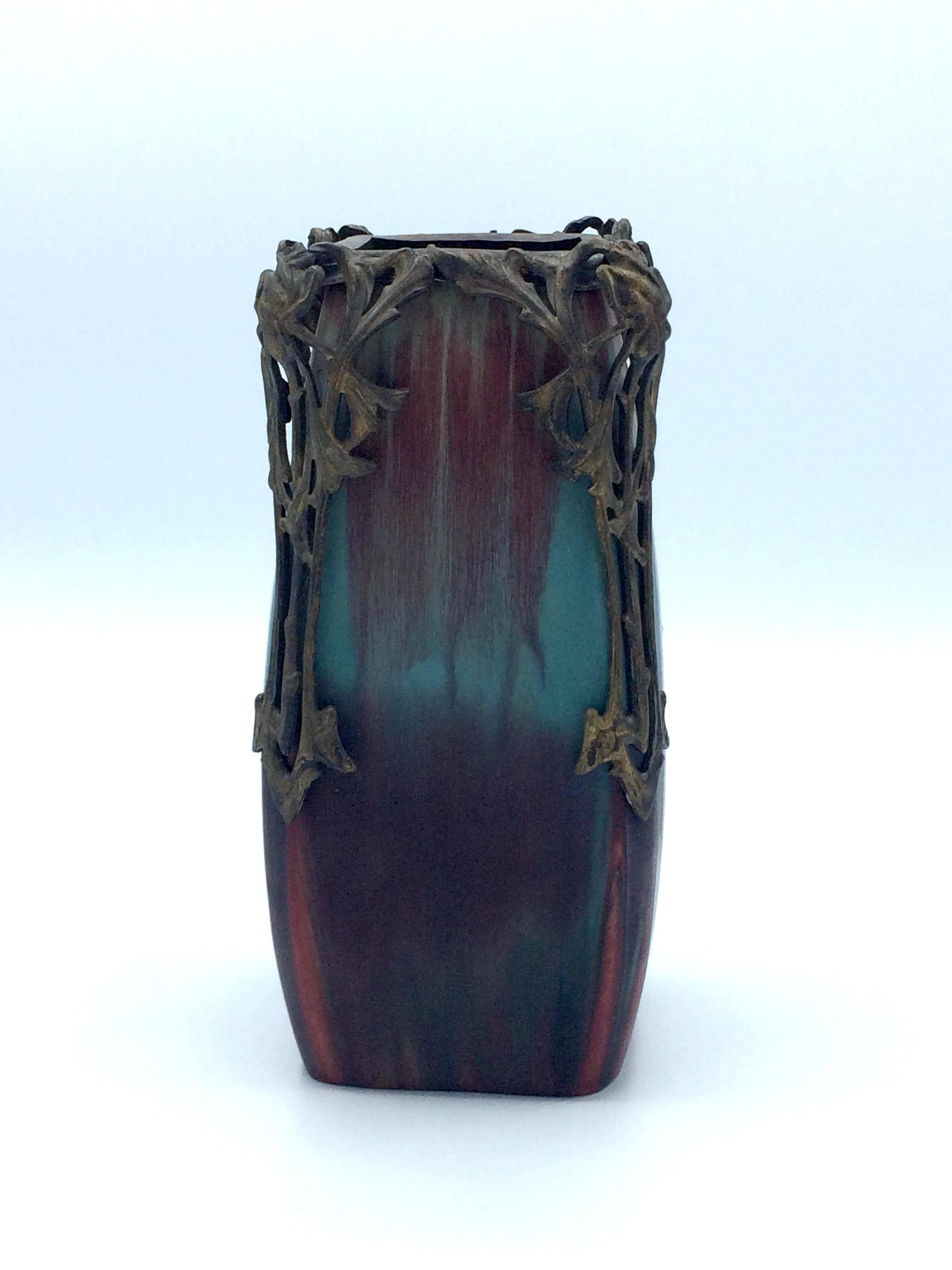 Exceptionally enameled quality vase by Eugene Baudin (1843-1907) using turquoise and oxblood glaze. Metallic mount by the hand of Marcel Bing or Lucien Gallard. Gorgeous piece in original condition.
 