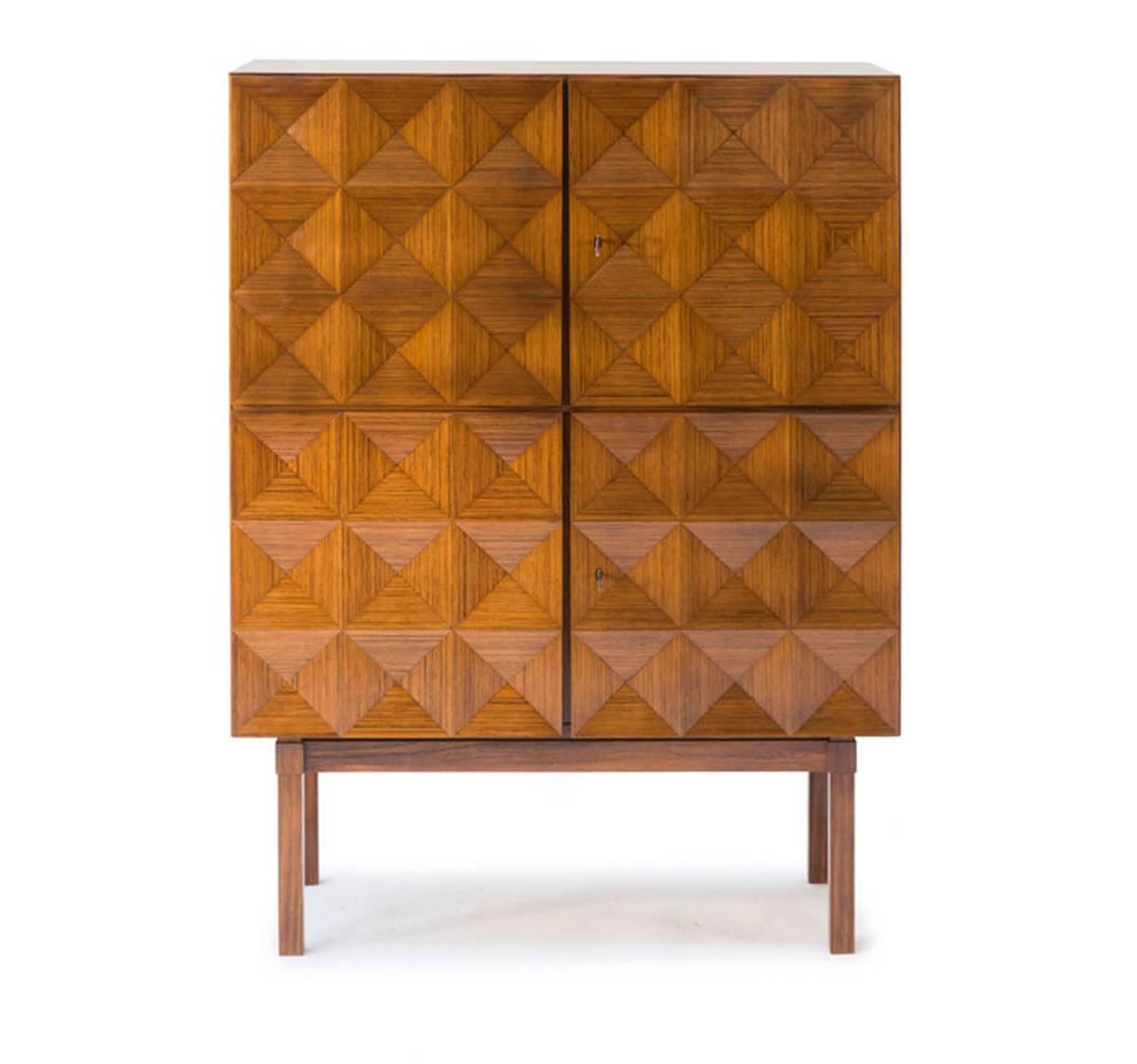This subtle "brutal looking" highboard is a feast for the eye and in real life as beautiful as on the pictures. The piece bears a great resemblance to the work of Antoine Philippon and Jacqueline Lecoq for Behr. Especially the diamond