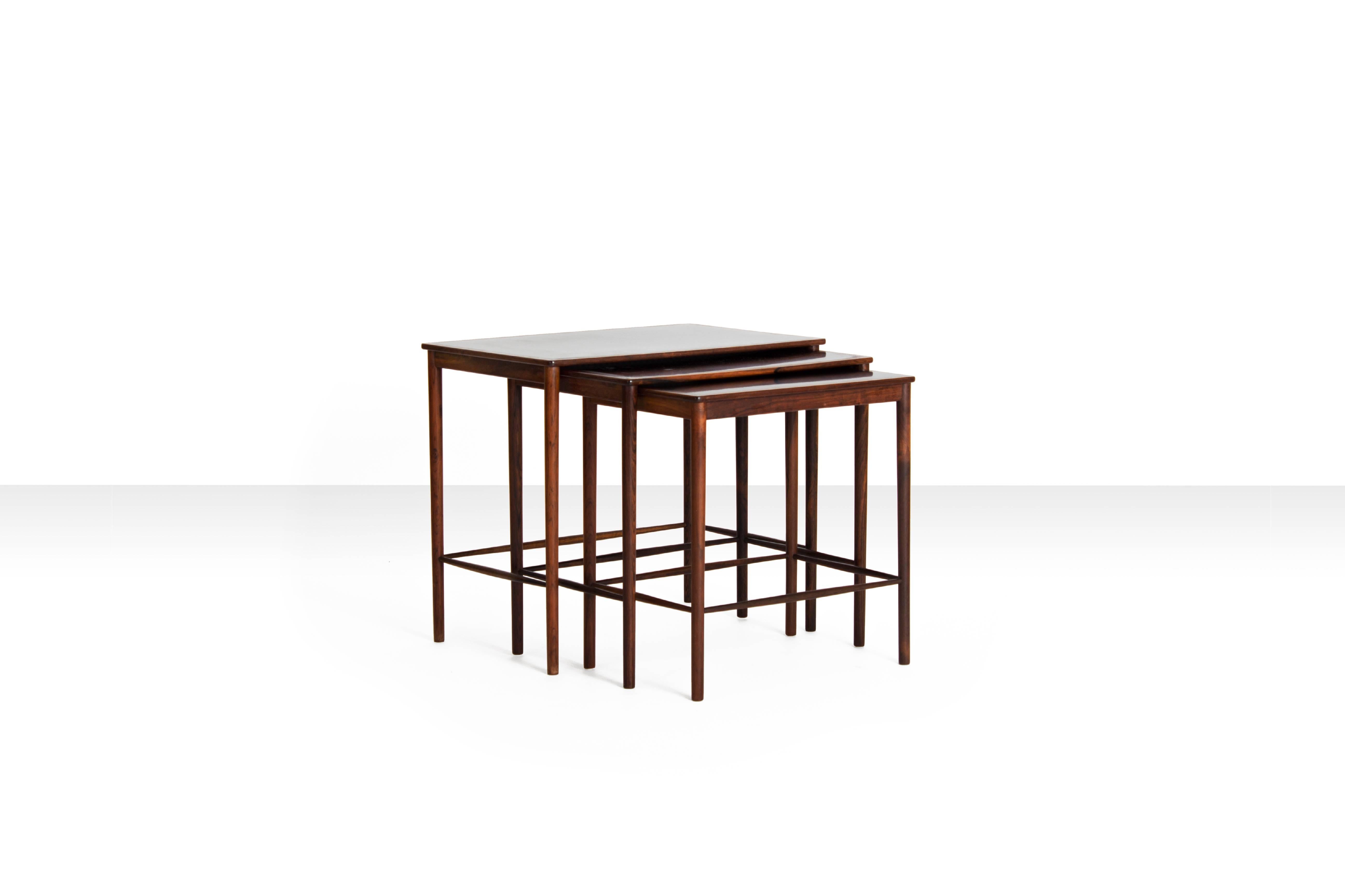 Rosewood and formica nesting tables by Kaj Winding for P. Jeppesens Møbelfabrik, Denmark 1960s

The craftsmanship on these pieces is truly marvellous. Standing next to the 'curva' chairs by Brazilian designer Joaquim Tenreiro a lot of visitors of