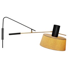 Metal and Brass Wall Lamp in the manner of Maison Lunel, France ca 1960s