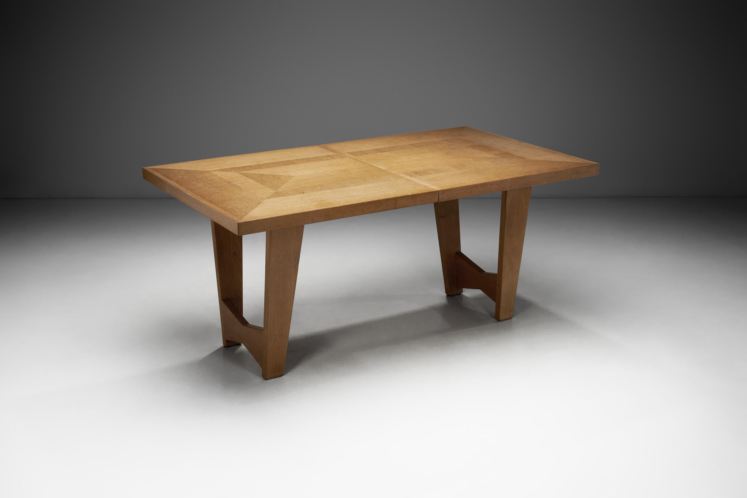 Designed by Guillerme et Chambron for Votre Maison in 20th-century France, this extendable dining table reflects the designers’ signature blend of bold construction and sculptural modernism. Robert Guillerme and Jacques Chambron were known for their