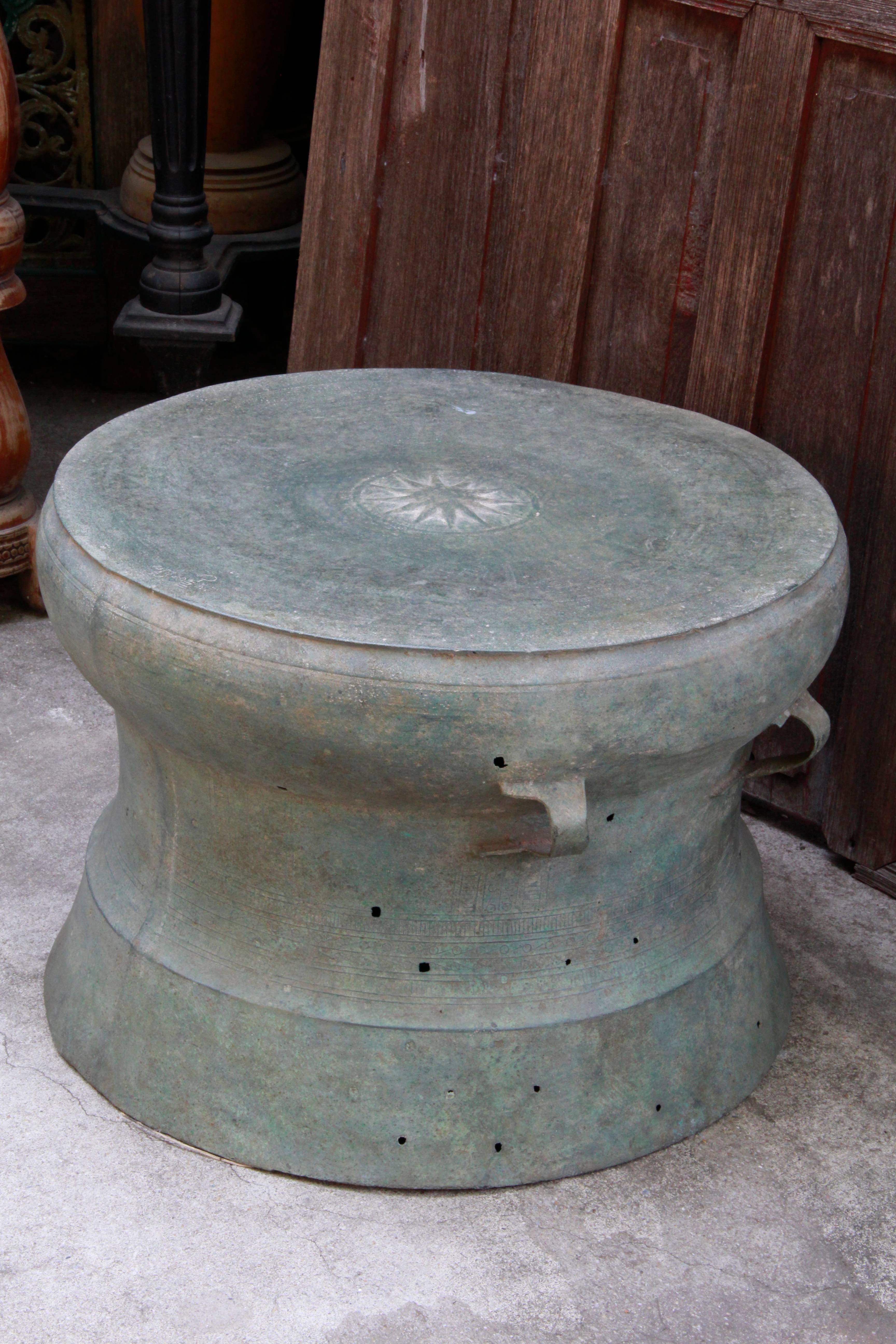 A rare and beautiful Heger Type I, excavated bronze Dong Son civilization ‘Vietnam’ ritual drum that evokes a sense of mystery and soulfulness. The prominent symbol is a twelve pointed star that sits atop the tympanum. Interlocking S-shaped spirals