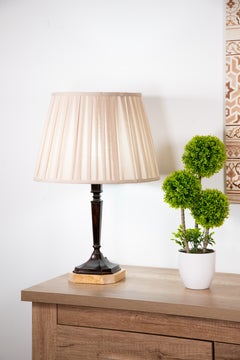 Bronze lamp in the shape of a stipe. Patinated bronze, marble base.