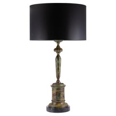 Candlestick-shaped lamp, patinated bronze. Black marble base.