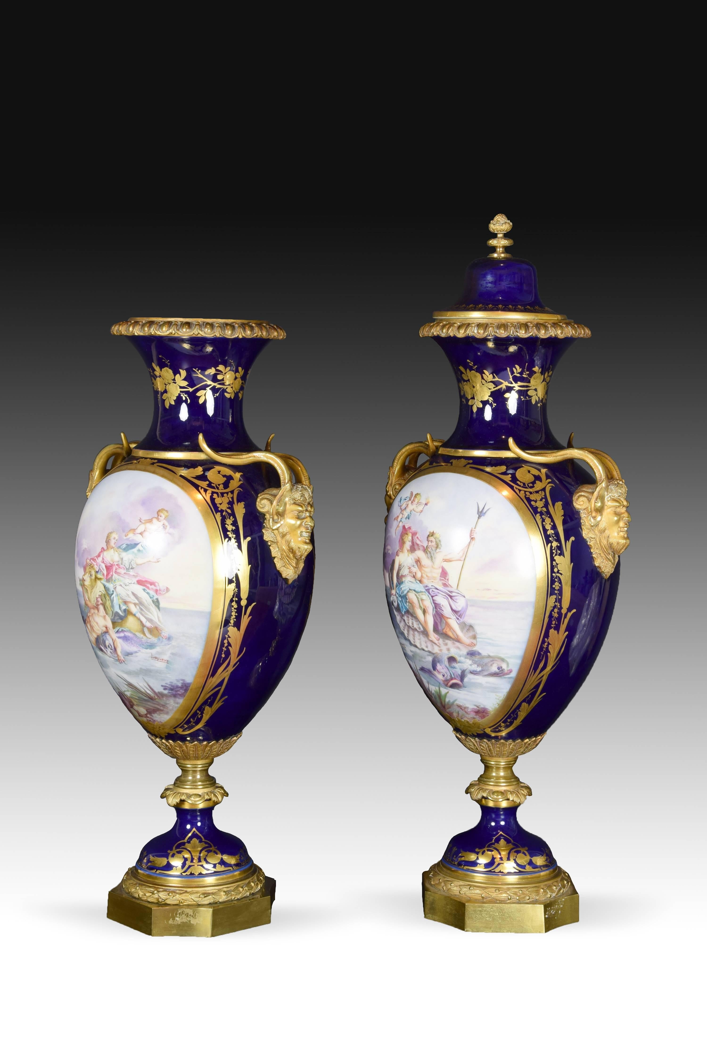 Blue cobalt porcelain and bronze pair of vases. Manufacture Nationale de Sèvres (France), 19th century. 
With scenes after Lesueur.
Both vases have the same shape and same decorative elements in gilded bronze applied to it. A polygonal base with a