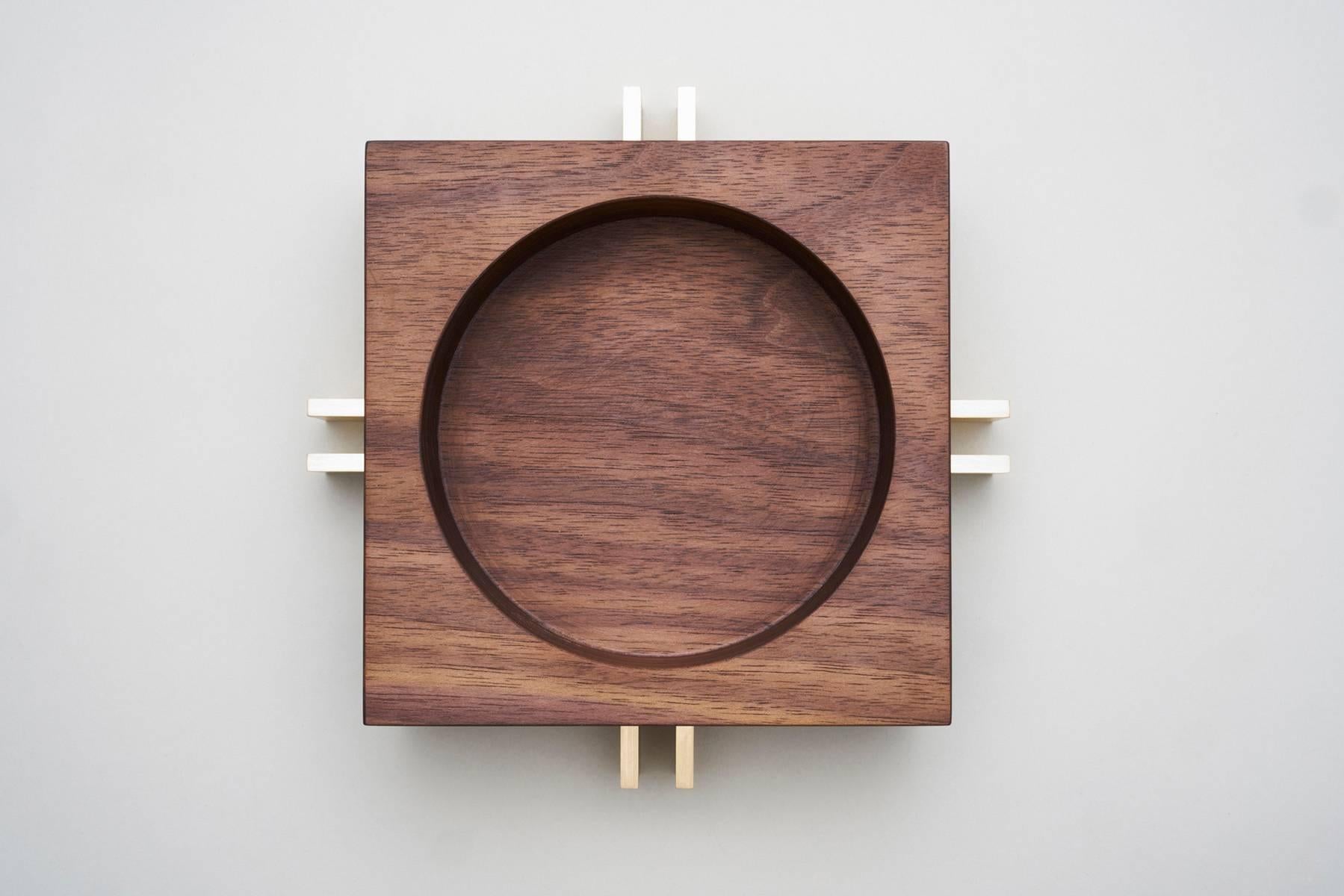 Brushed brass plate and American walnut timber unite in this petite version of our parallel bowl. 
The timber bowl nestles within the brass base and are two separate pieces.
The walnut has been given a light oil finish whilst the brass has been