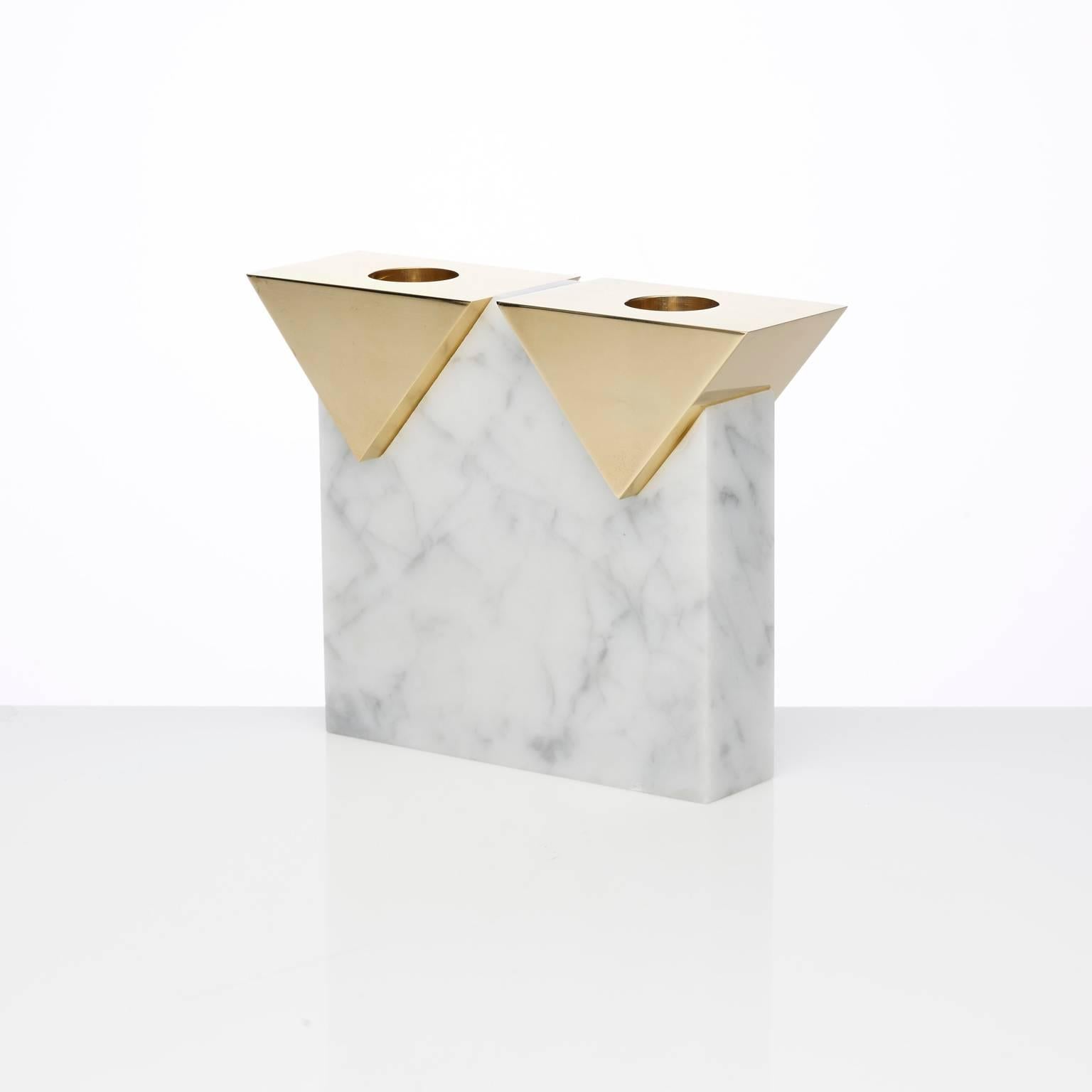 A double candleholder based on the architecture of our iconic Invisible Cities candleholders.
A honed Carrara tower balances two polished brass triangular pieces.
The brass has been polished to a mirror finish and left untreated which will develop