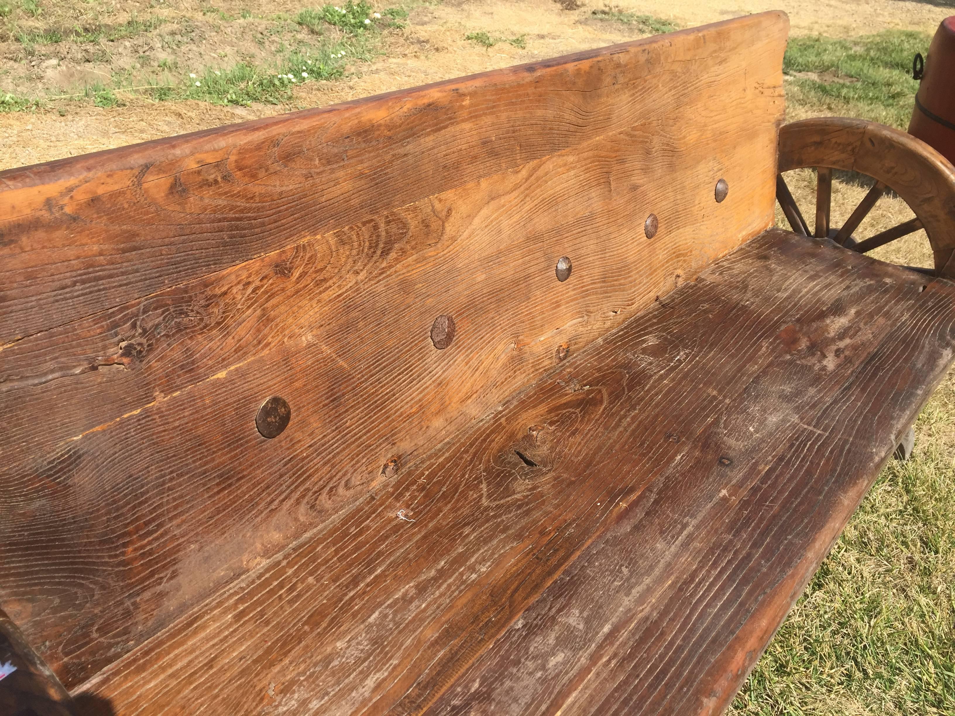A substantial rustic bench.

This one of a kind bench is made of old jujube logs. Jujube, with its dense, heavy substance and beautiful, unique lumps and knots in appearance, is highly valued in northern China for making substantial furniture.