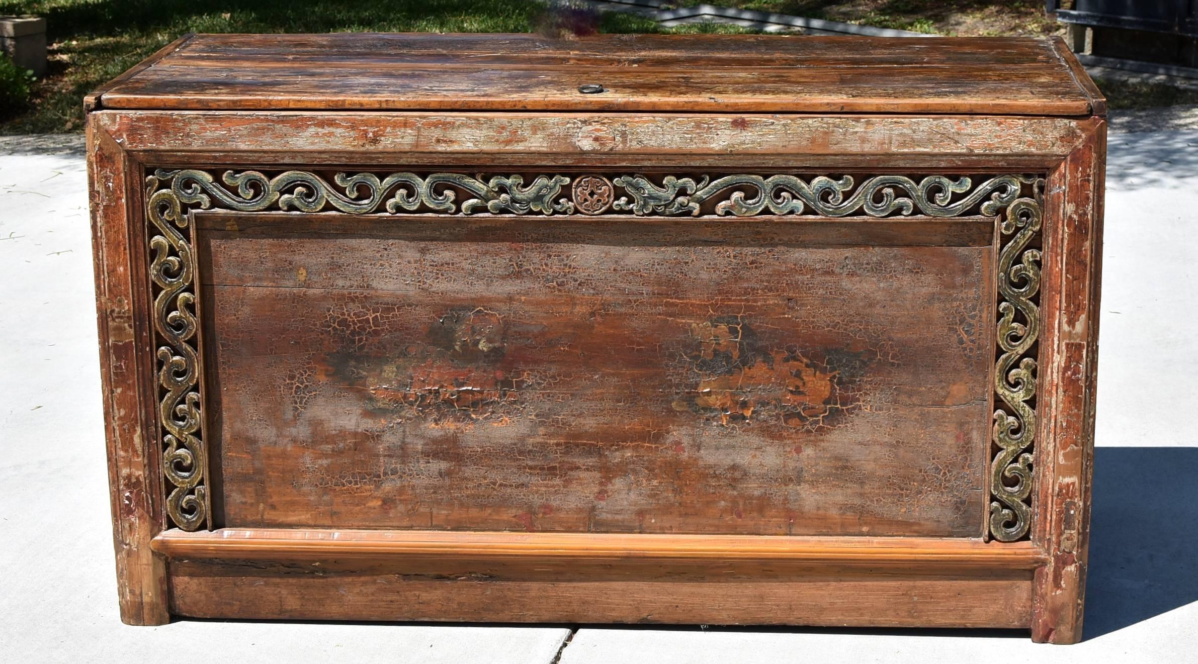 Beautiful Mongolian chest with two playful foo dogs. This is an all original, 19th century piece whose patina is well preserved. The crackled the finish is stable and enhances the charm of the chest. Beautiful, original colors include aquamarine