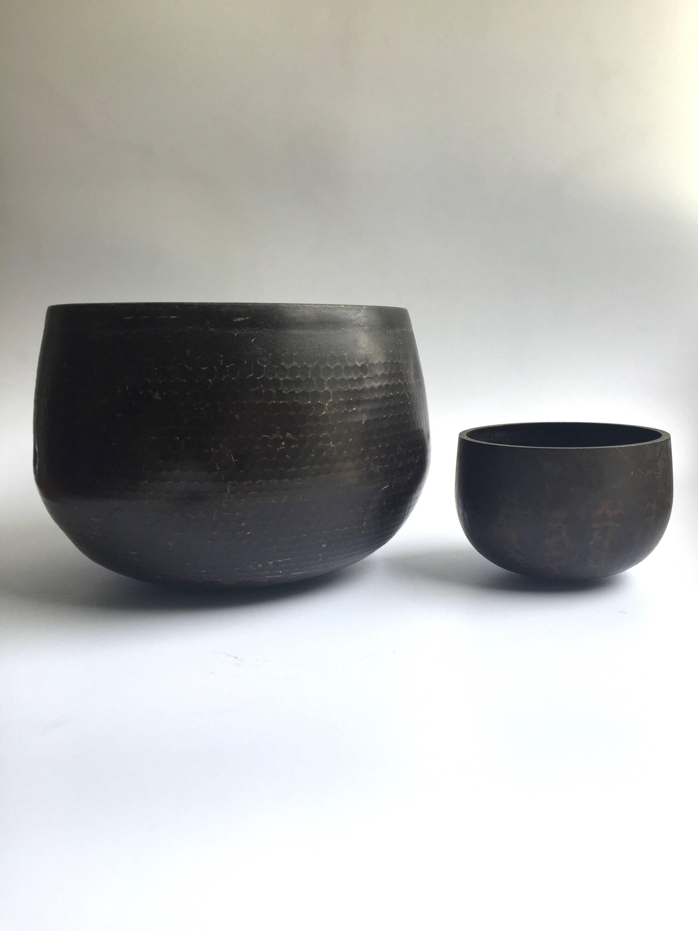 This is a set of substantial antique Japanese singing bowls.

The material is solid bronze. All patina is original. This bowl makes the most beautiful, enlightening, deep sound that is at once soothing and thought provoking.

The Japanese singing