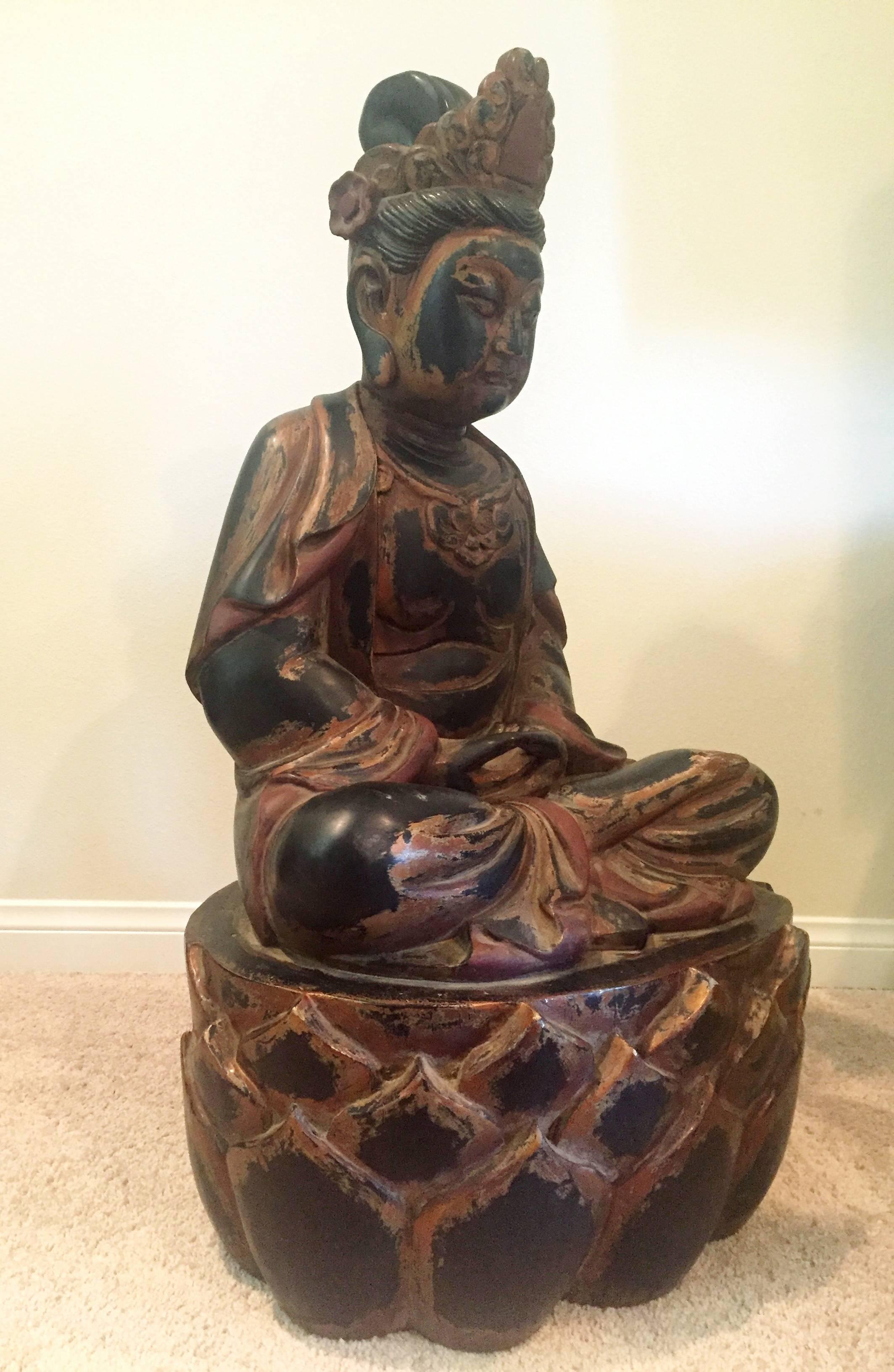 This stunning Buddha statue is carved of solid wood. At 40