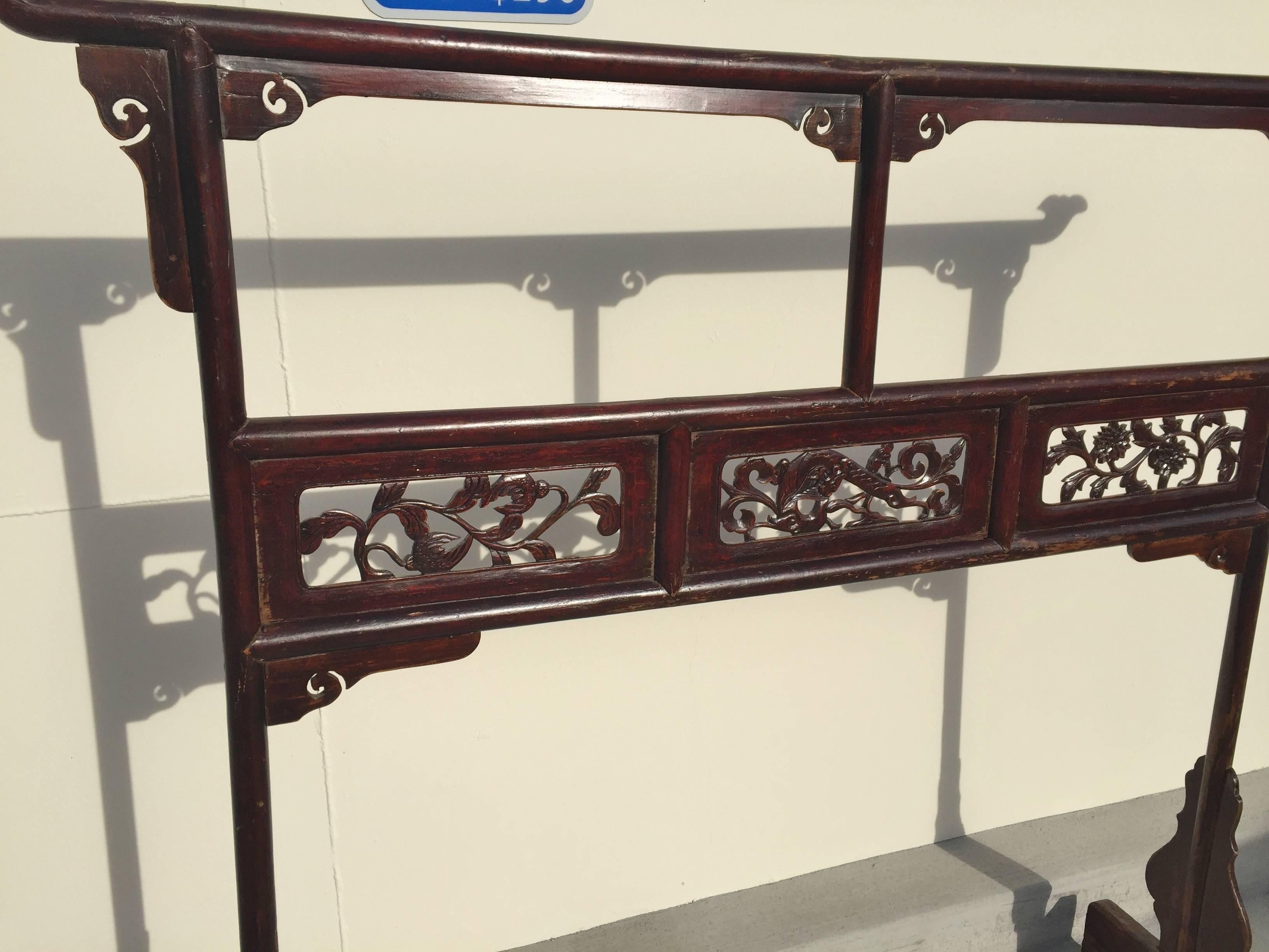 The garment rack is an unique piece of furniture used by the Chinese nobleman and noblewoman. Typically placed in a bedroom, it holds the robes they wear.

This beautiful piece features carved panels depicting flowers and water dragon. Delicate