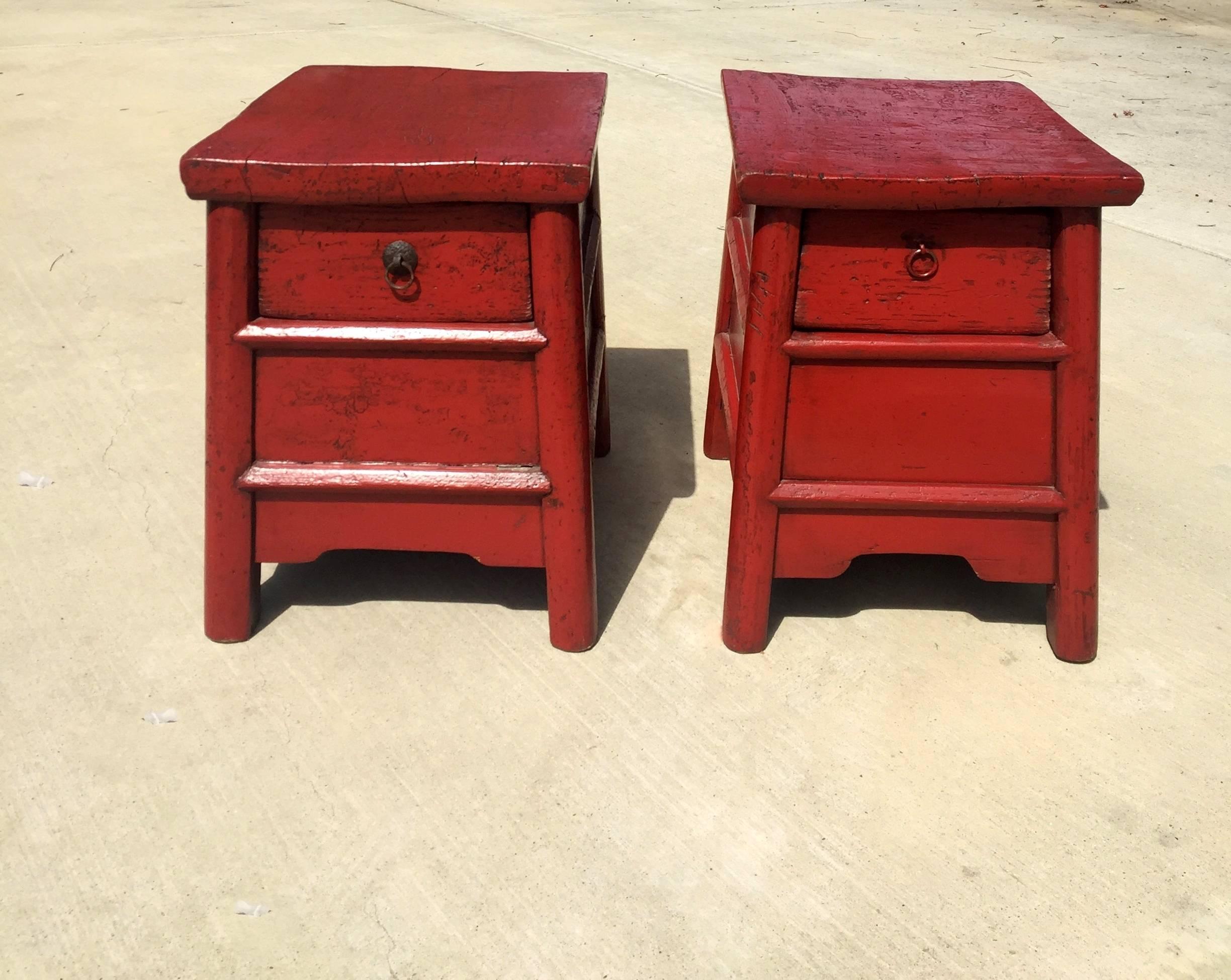 A pair of antique stools from Northern China. Beautiful red lacquer stool has wonderful, rustic country charm. With drawer and secret compartment under the drawer, the stool is also a chest to storage secret items. Thick single board makes the top.
