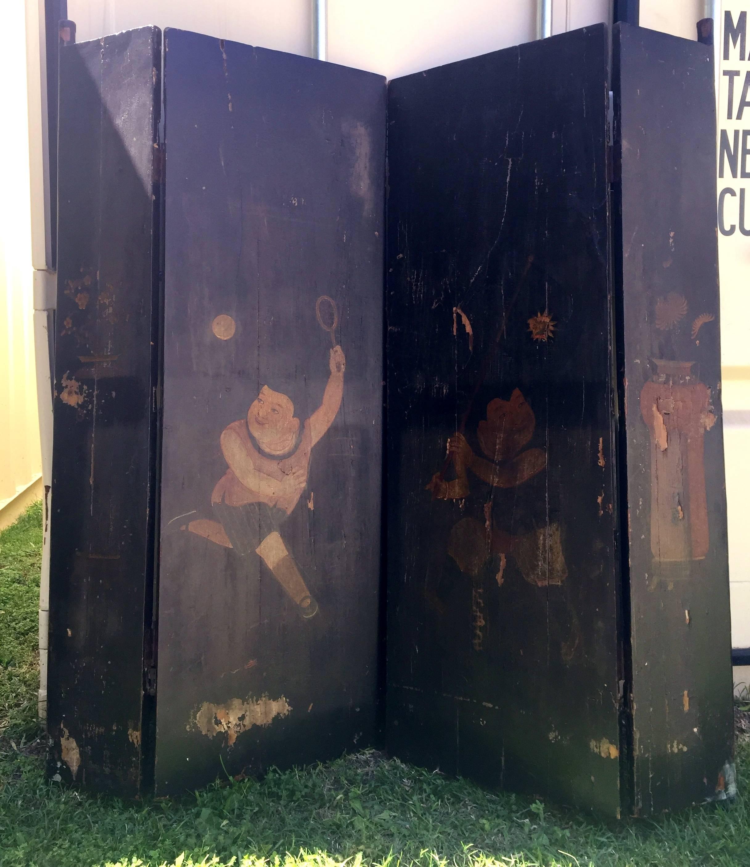 This pair of wonderful black lacquered doors is very special. Shorter and wider, they were made specially for the young sons of the family. Hand-painted images of boys playing a ball game express great pride and happiness. The boy's outfits and the