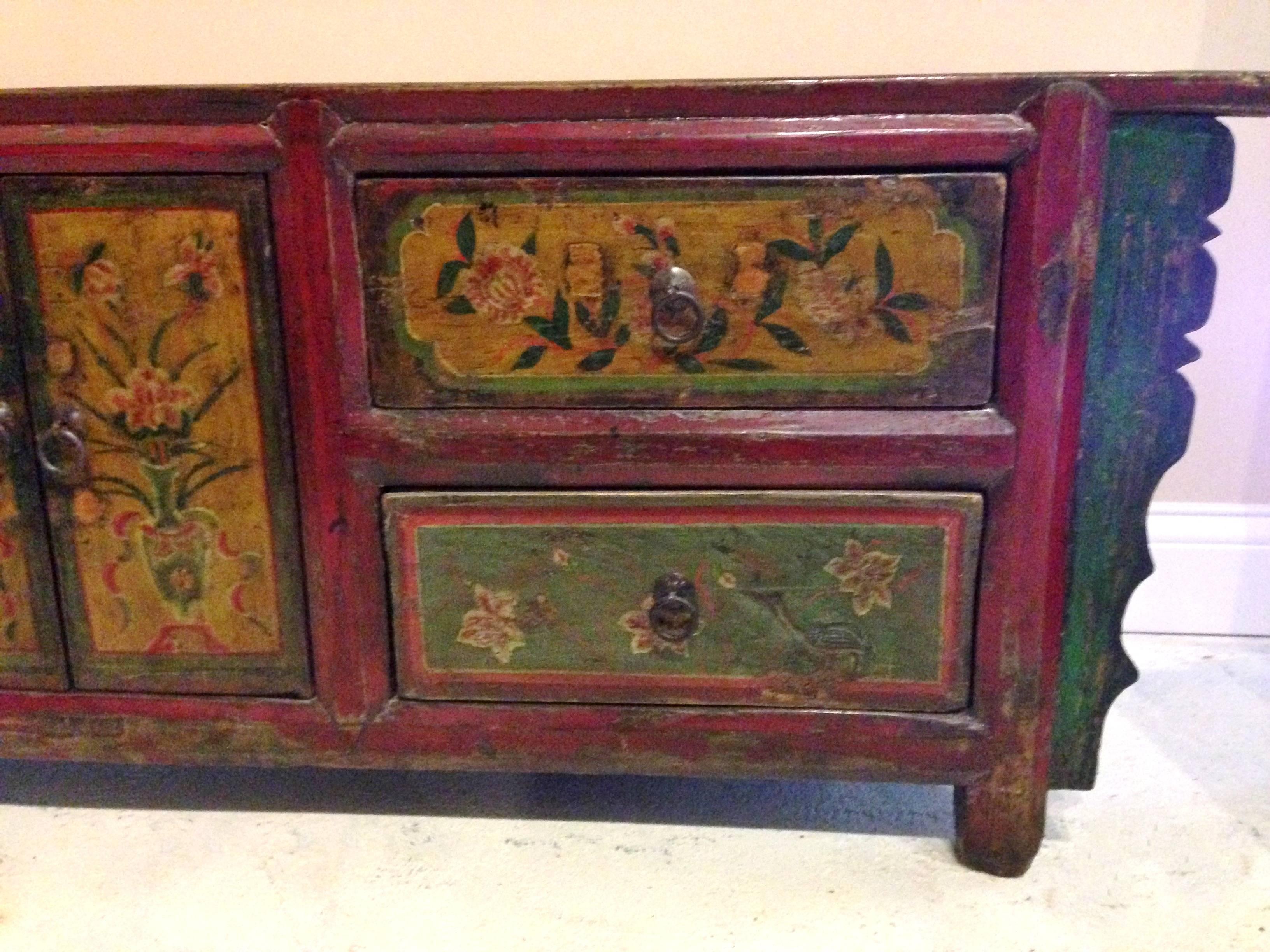 A beautifully painted chest from China's tribal village. 

The colors are simply splendid. The use of saffron and sage color is unexpected and refreshing. These colors derived from minerals and plants. Fantastic, exotic colors express happy