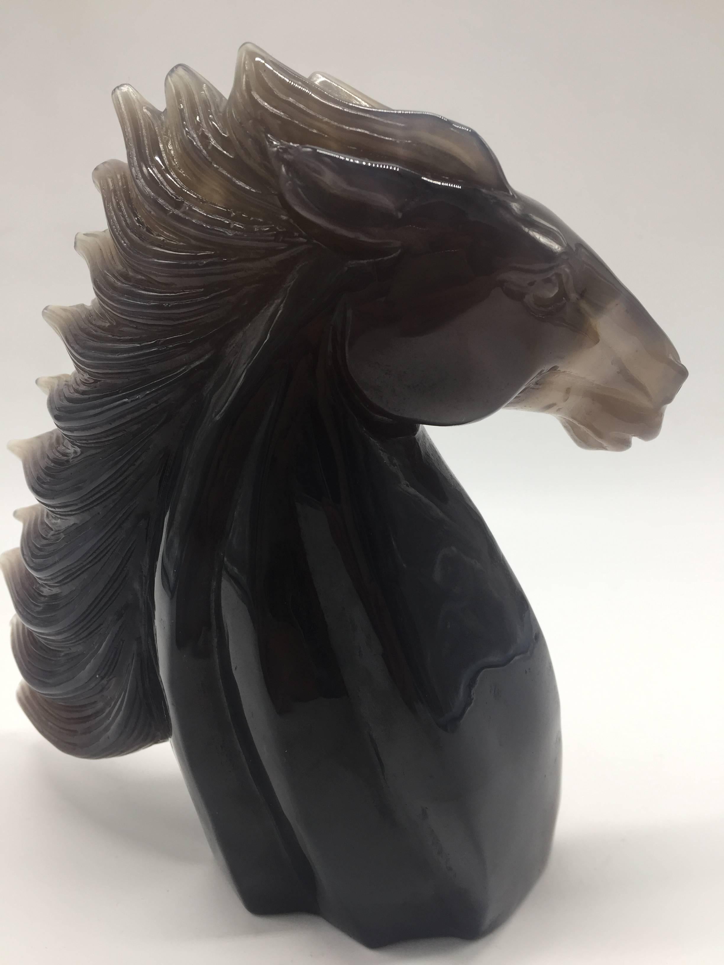 A beautiful all natural agate horse. 

This stunning sculpture is made of pure agate. The art piece preserved the original characters of the gem stone, showing the amazing crystal Formations. The horse is beautifully carved with vivid expressions