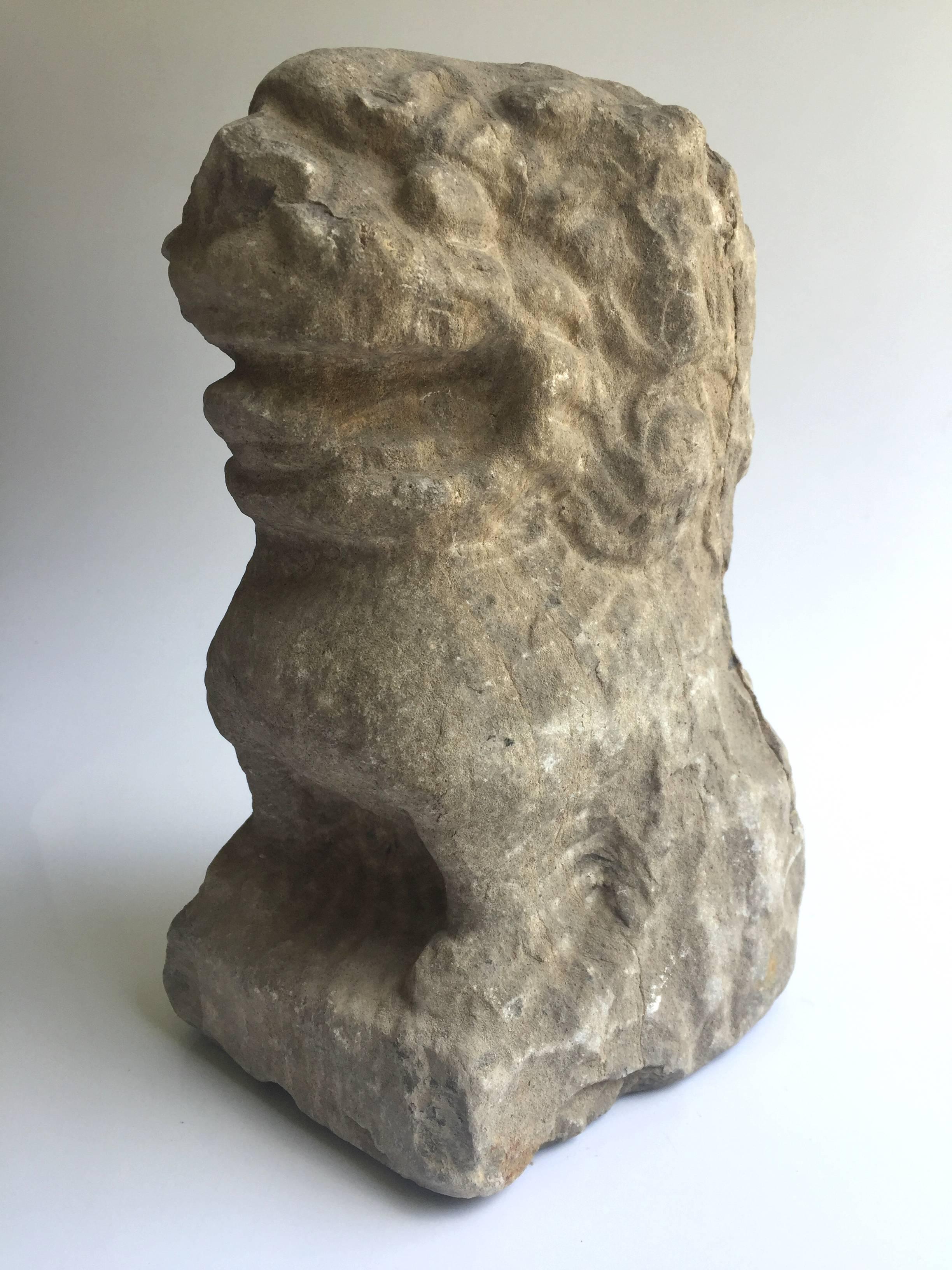 This stone foo dog is a wonderful treasure. Completely originally, this is an old piece from a private garden in northern China. It has a young and adorable expression, with his mouth wide open, giving a toothy grin. All patina natural to the piece.
