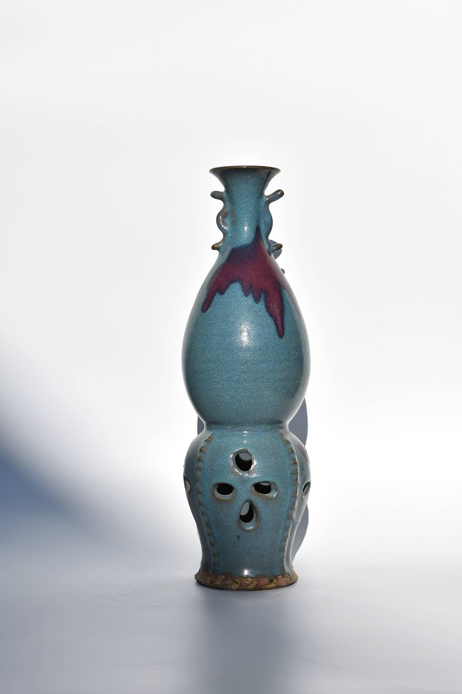 A splendid Jun ware Porcelain aromatizer.

Jun ware, is one of the most important kilns in China. Originated in Tang dynasty, Jun kiln produces the most splendid, free style colors. Porcelains go into the kiln with no color at all, but emerges with