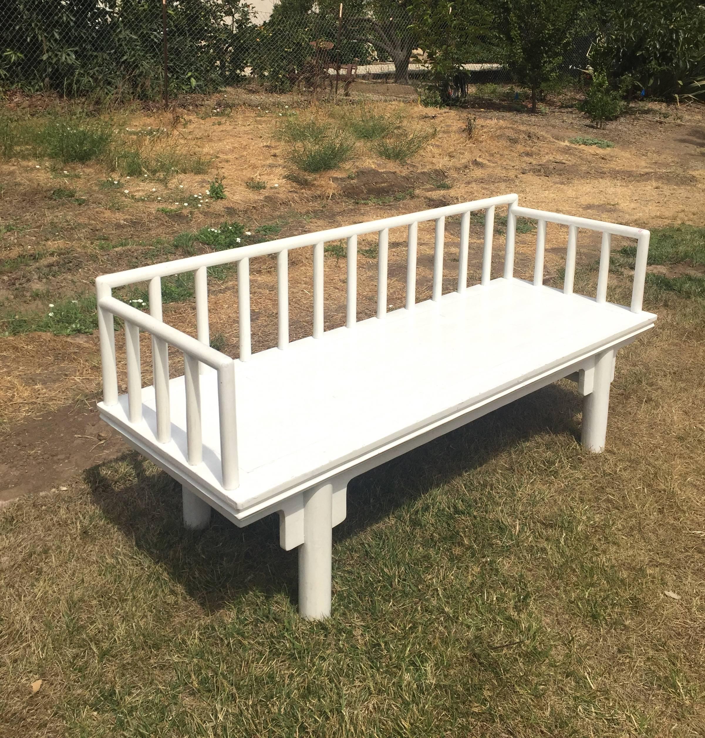 A white lacquered Chinese bench. 

Simple, beautiful straight line is a Ming dynasty trademark. Rounded legs echo the rounded spindles. A great piece for a modern, artistic home. 

Solid wood. Tenons and mortises.