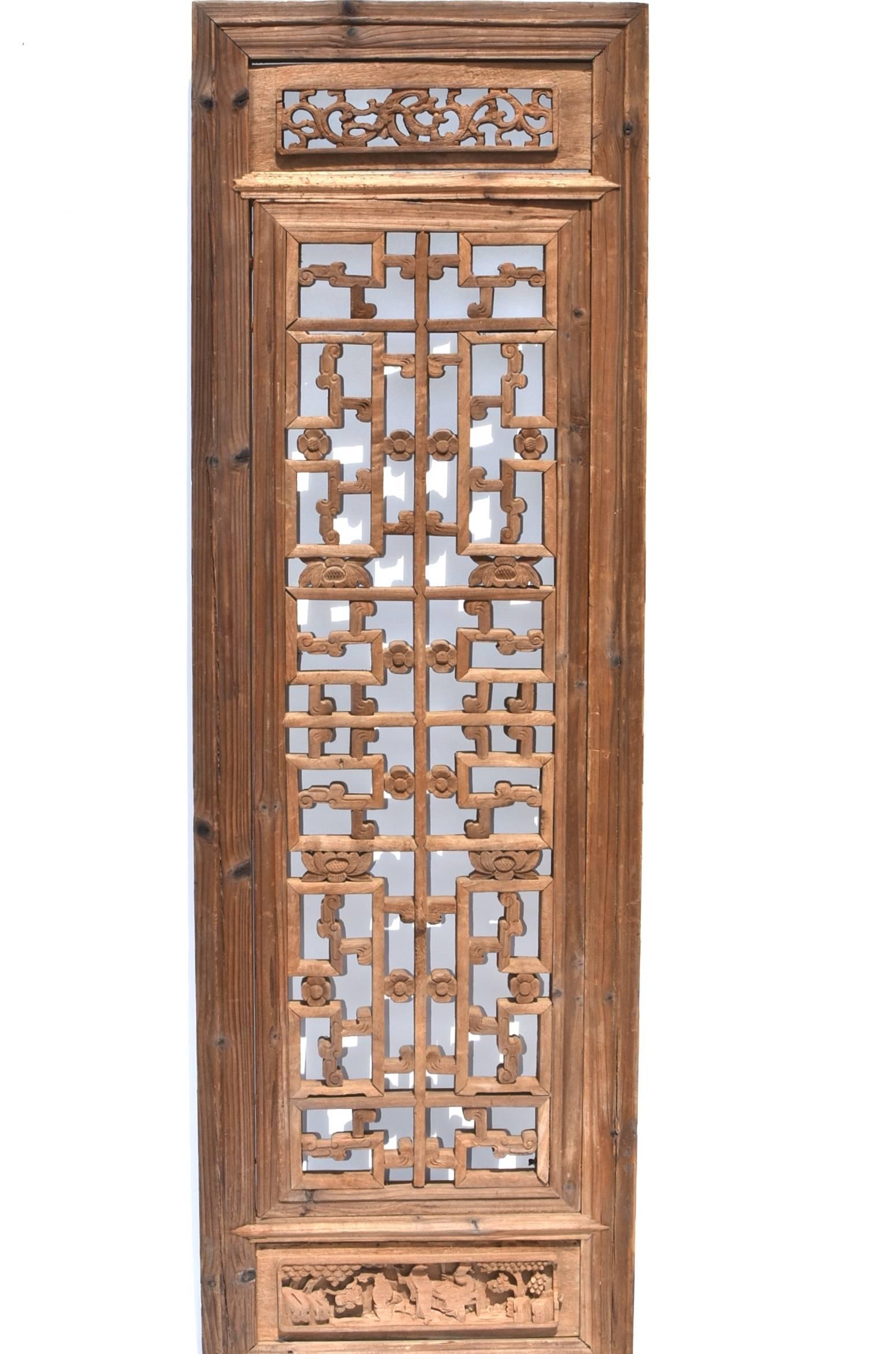 A beautiful 19th century screen with carved peonies and dragon scrolls. The construction is joinery with tenons and mortises. All painstakingly done by hand. This piece makes a sophisticated wall decoration besides being a screen. Solid wood.
