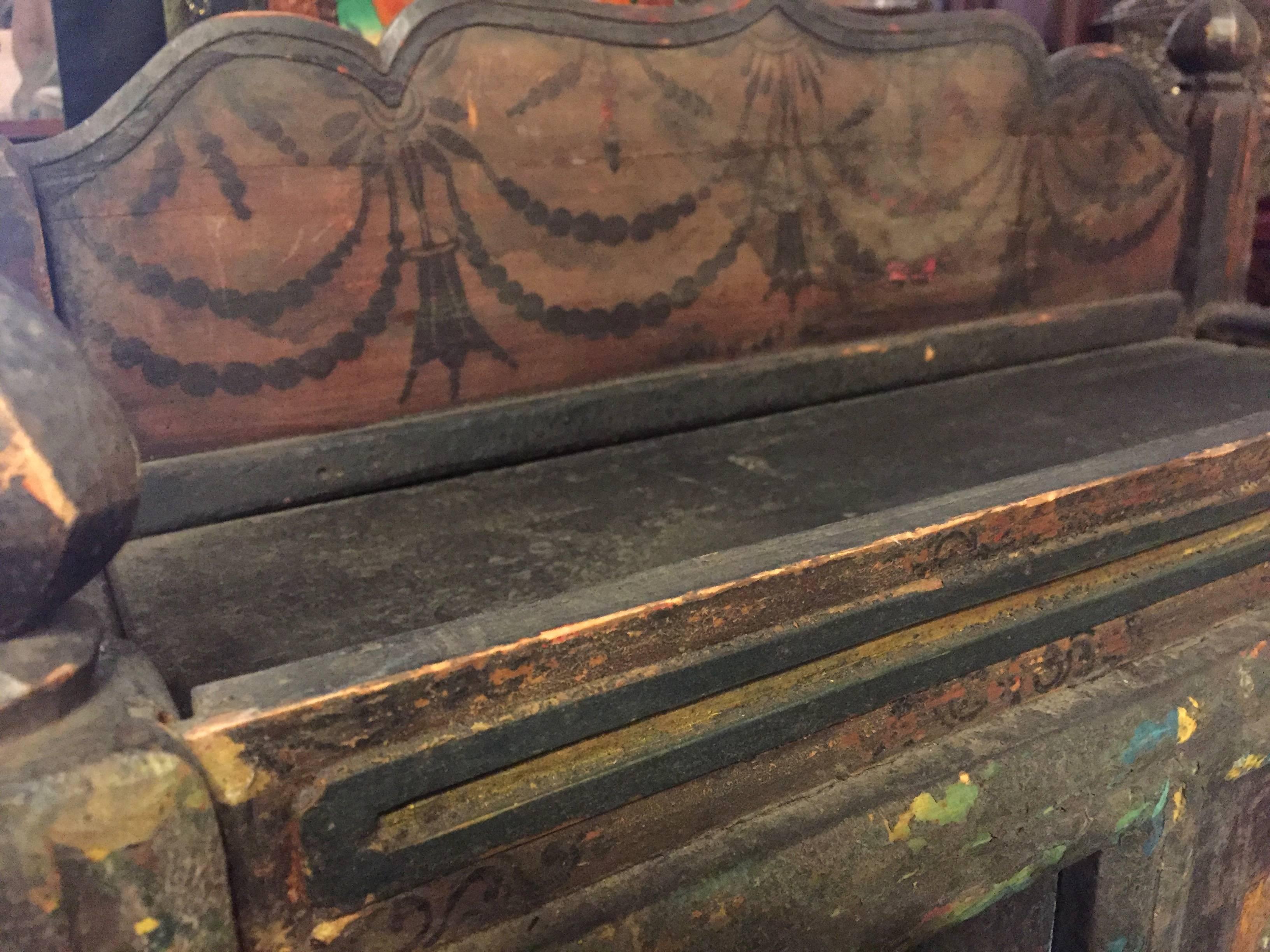 A rare, one of a kind, hand-painted Tibetan chest that dates to early 19th century. The chest features three panels of hand-painted images showing scholars at leisure. From the remnants of the art, we can still see finely painted furniture, green