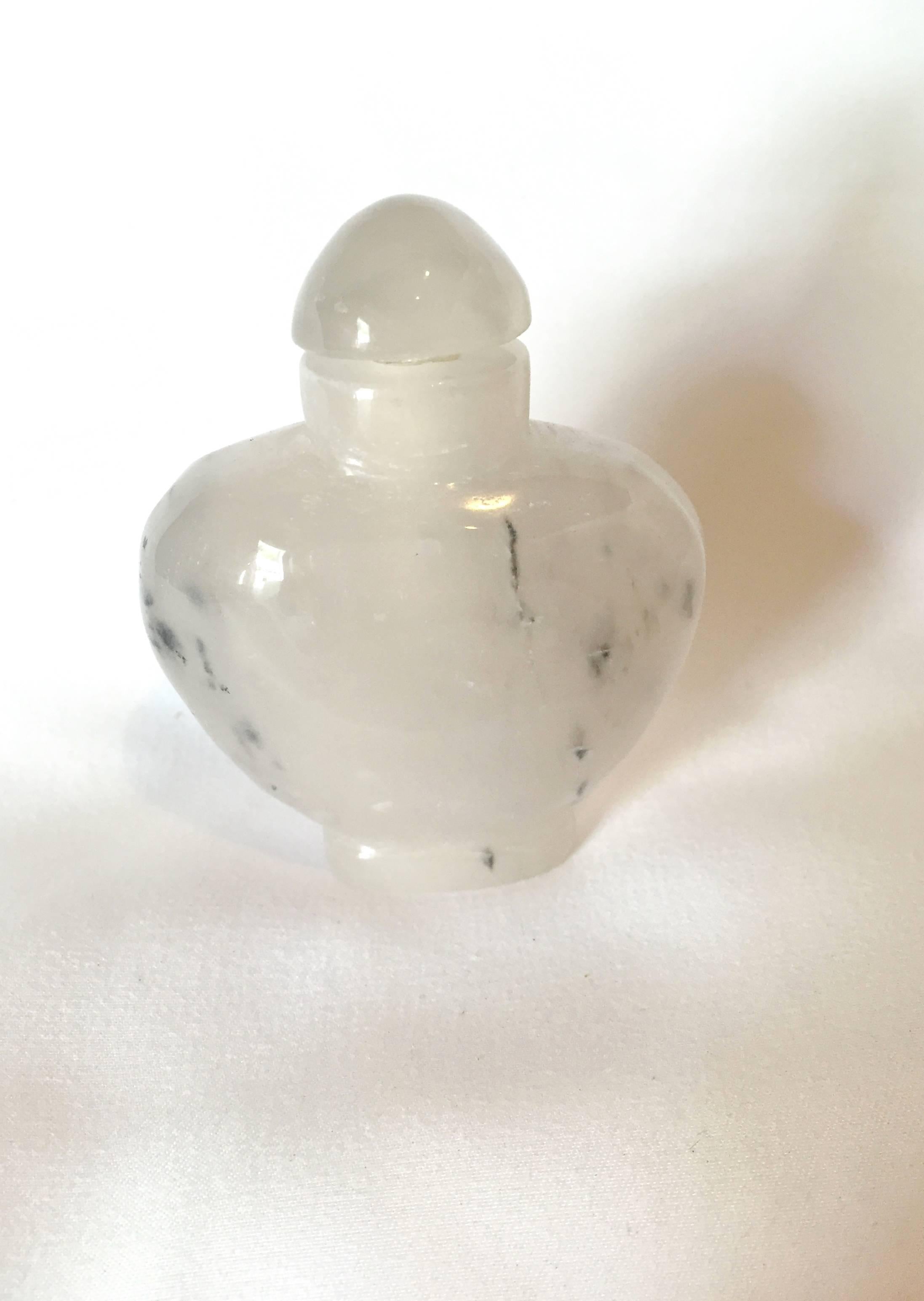 This romantic piece is carved from the beautiful moss agate. With the natural inclusions that resemble white clouds and black bamboos, the bottle looks like an abstract watercolor painting. The stone is polished skilfully to a beautiful lustre. A