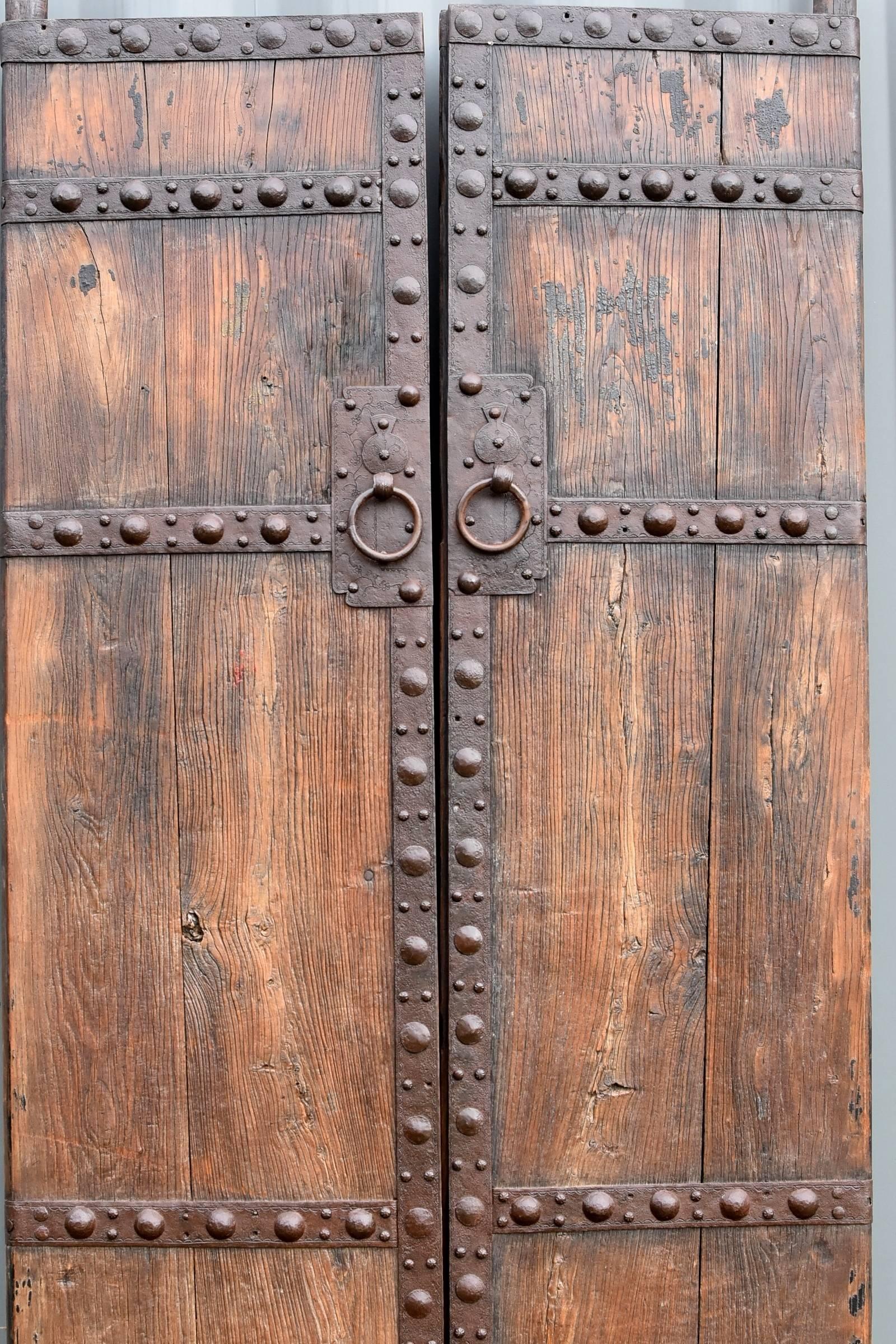 A pair of strong, rustic antique doors from northern China. 

These are very heavy, substantial, solid wood doors. The 2