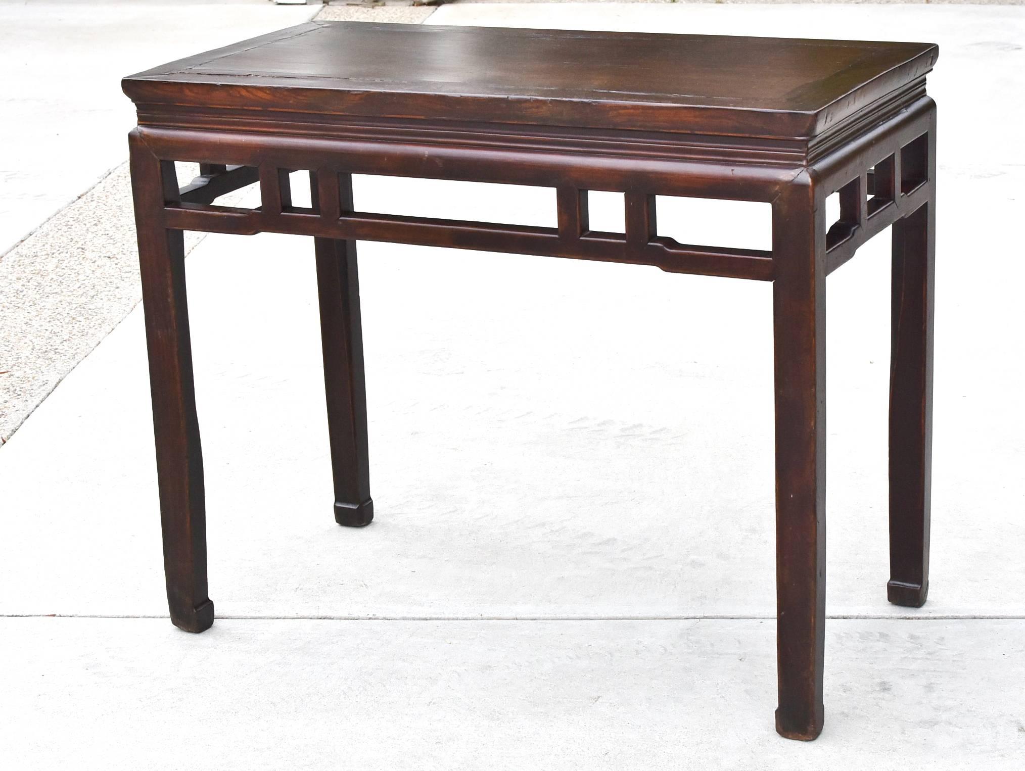 This piece demonstrates all the hallmarks of a Ming dynasty furniture. Choice of beautiful woods and elegant, simple lines make the table timeless. Straight non-fussy stretchers and hoof legs. The table is finished all around and the perfect size to