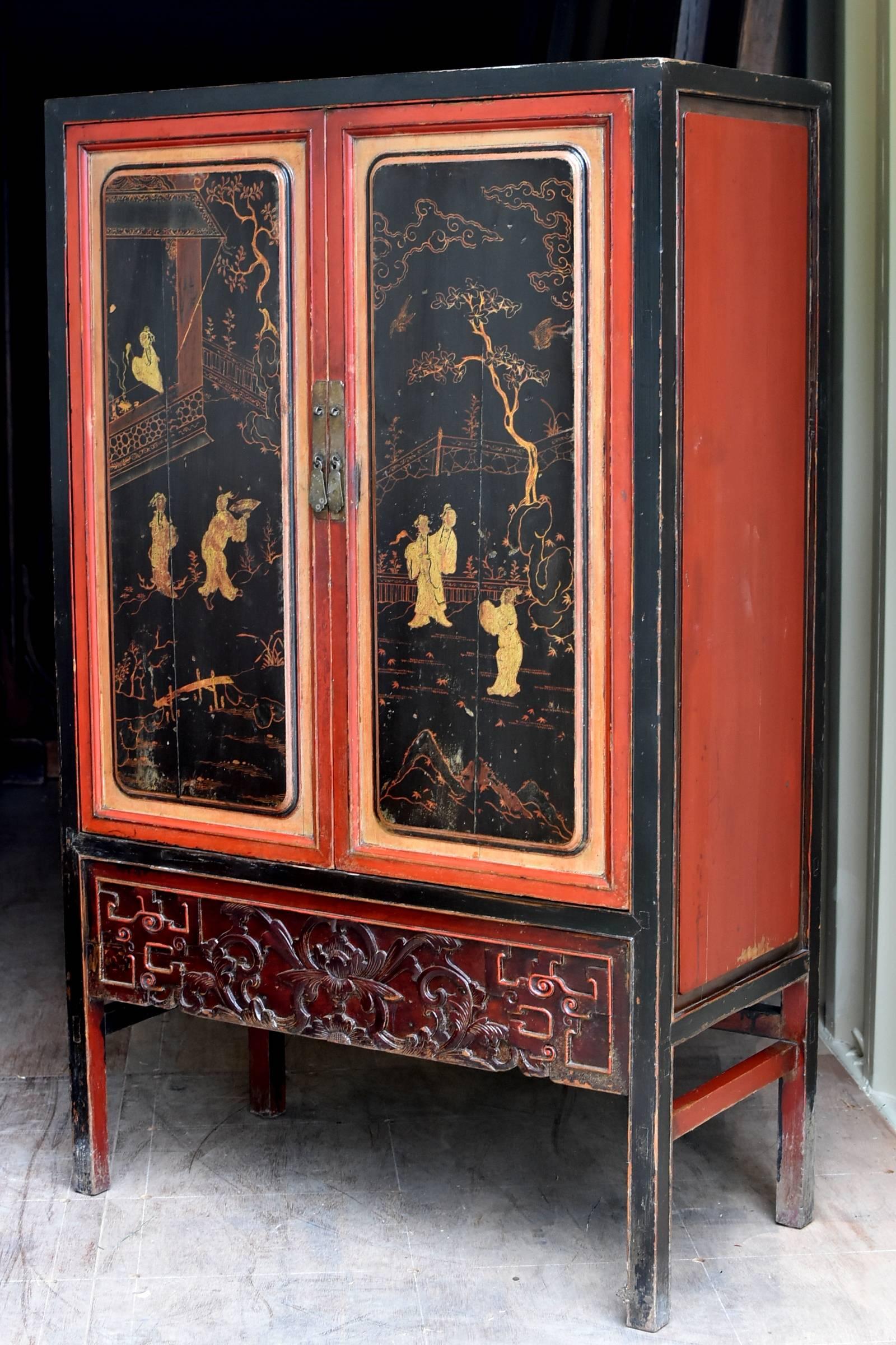 Beautiful cabinet with contrasting colors showcases the beauty of furniture made by Southern Chinese artist. Hand-painted scene depicts a family's happy leisure life at the home garden with pine trees, bridges, and a pavilion. The bottom section has