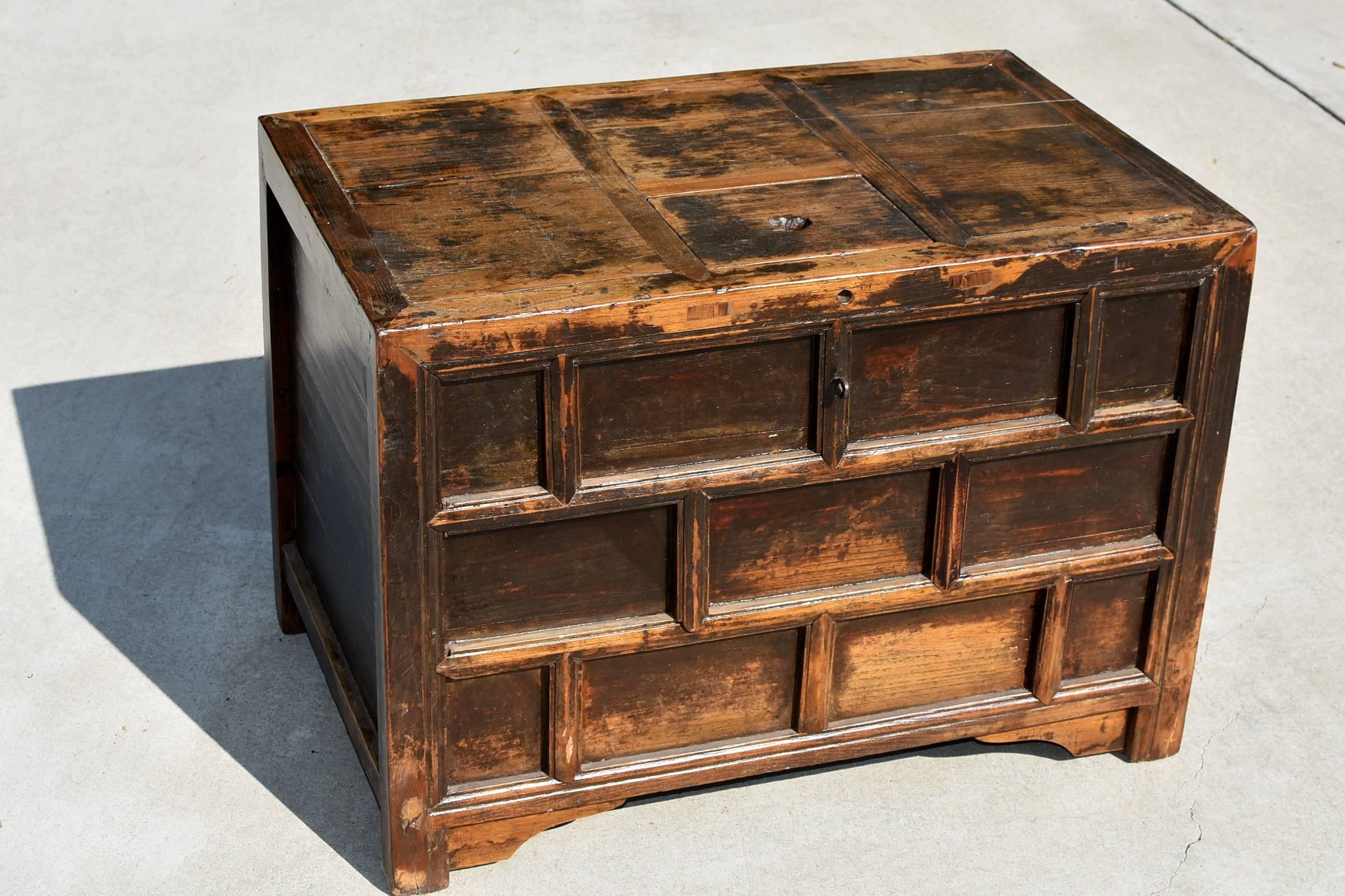 Rustic charming money chest was used by merchants in the 19th century to keep currency, especially coins. The chest is sealed all around except a top opening for maximum security. Vertical bars strengthen the construction, adding stability and