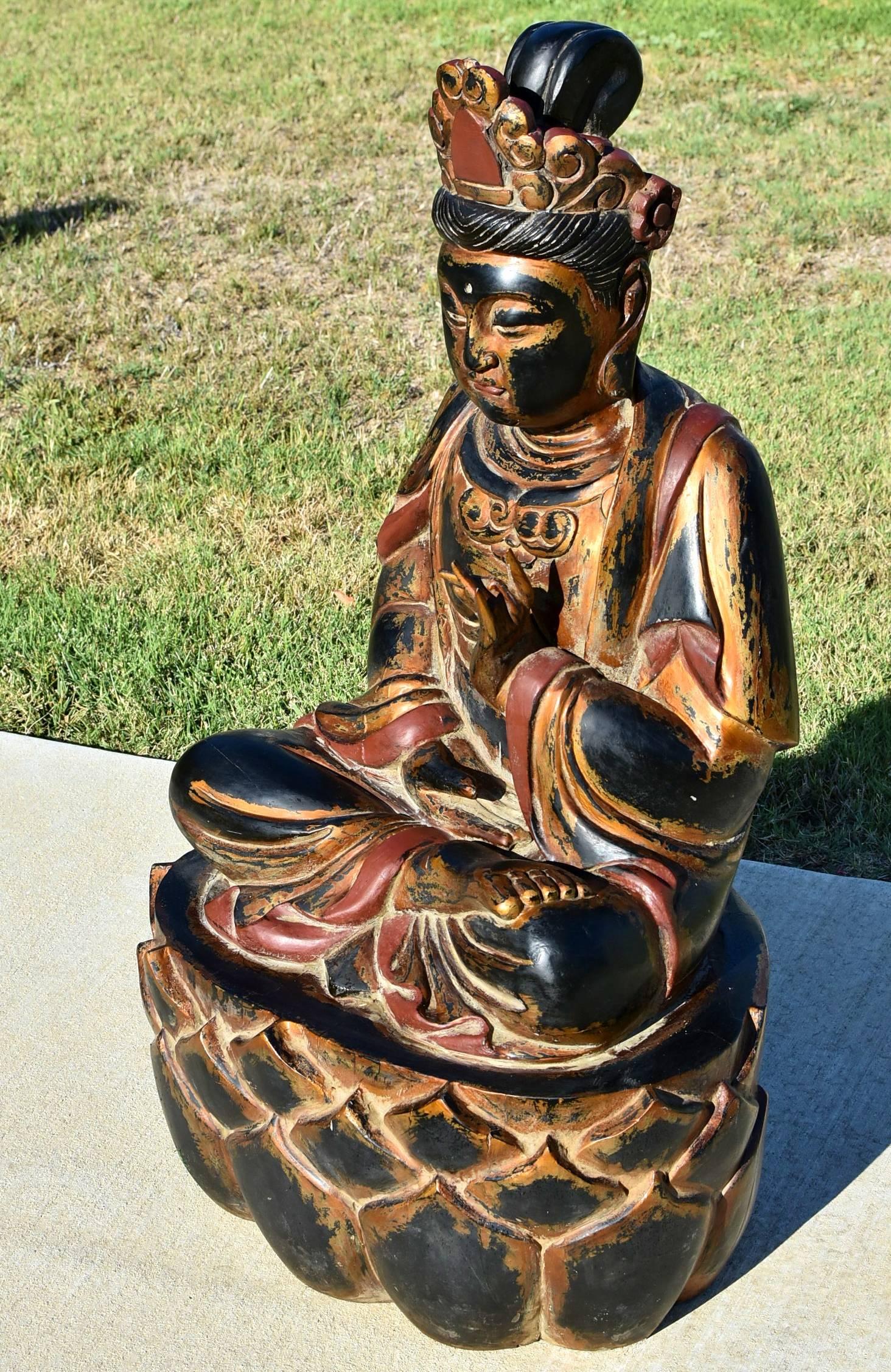 A beautiful solid wood Buddha statue. The Buddha is seated on a lotus throne. His face is serene and peaceful. The statue is of the Tang dynasty style, with a full and round face. Fingers are beautifully done as well as robe and crown.

This is a
