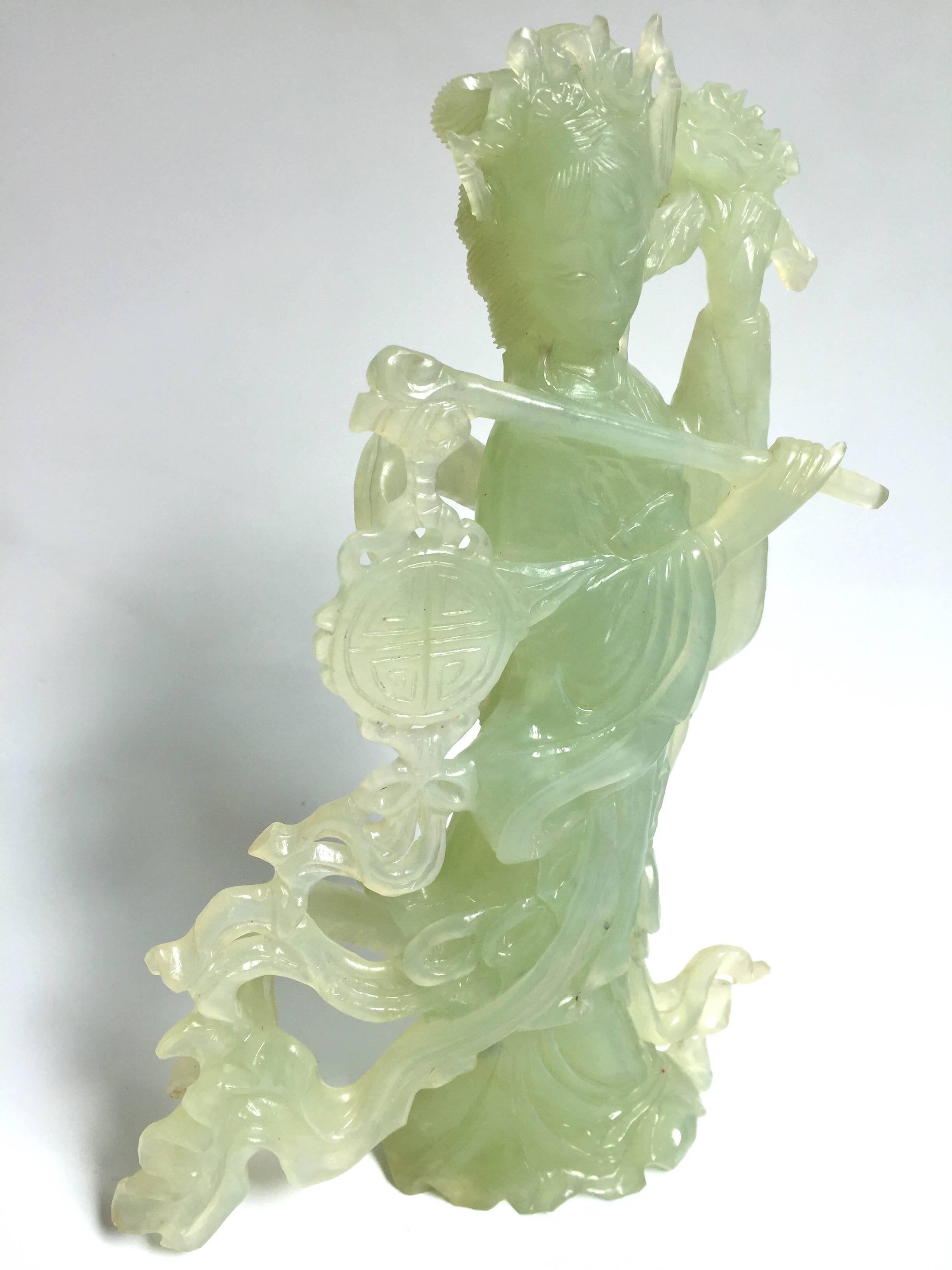Absolutely beautiful statue of the Chinese Moon Fairy.

The statue is made of all natural green serpentine. It is hand-carved by a master. Her facial features and fingers are finely done. Her robe and ribbons flying in the wind adds movement to