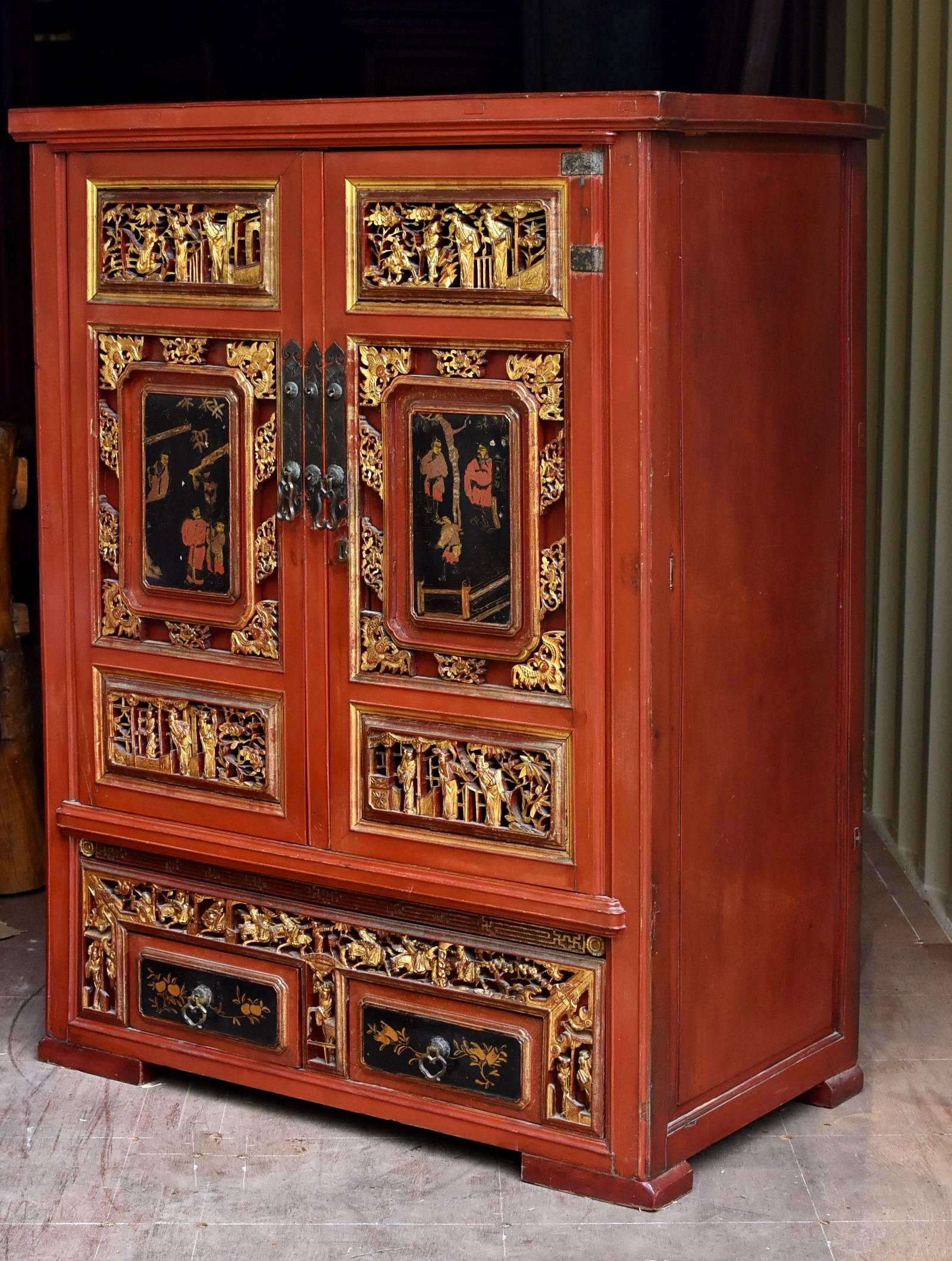 This rare, magnificent, fully carved, gilded cabinet was a scholar's treasure chest. hand-painted door panels depict the scholar's peaceful retirement life at the village. At one scene, he was tending to his garden while receiving a visitor. At