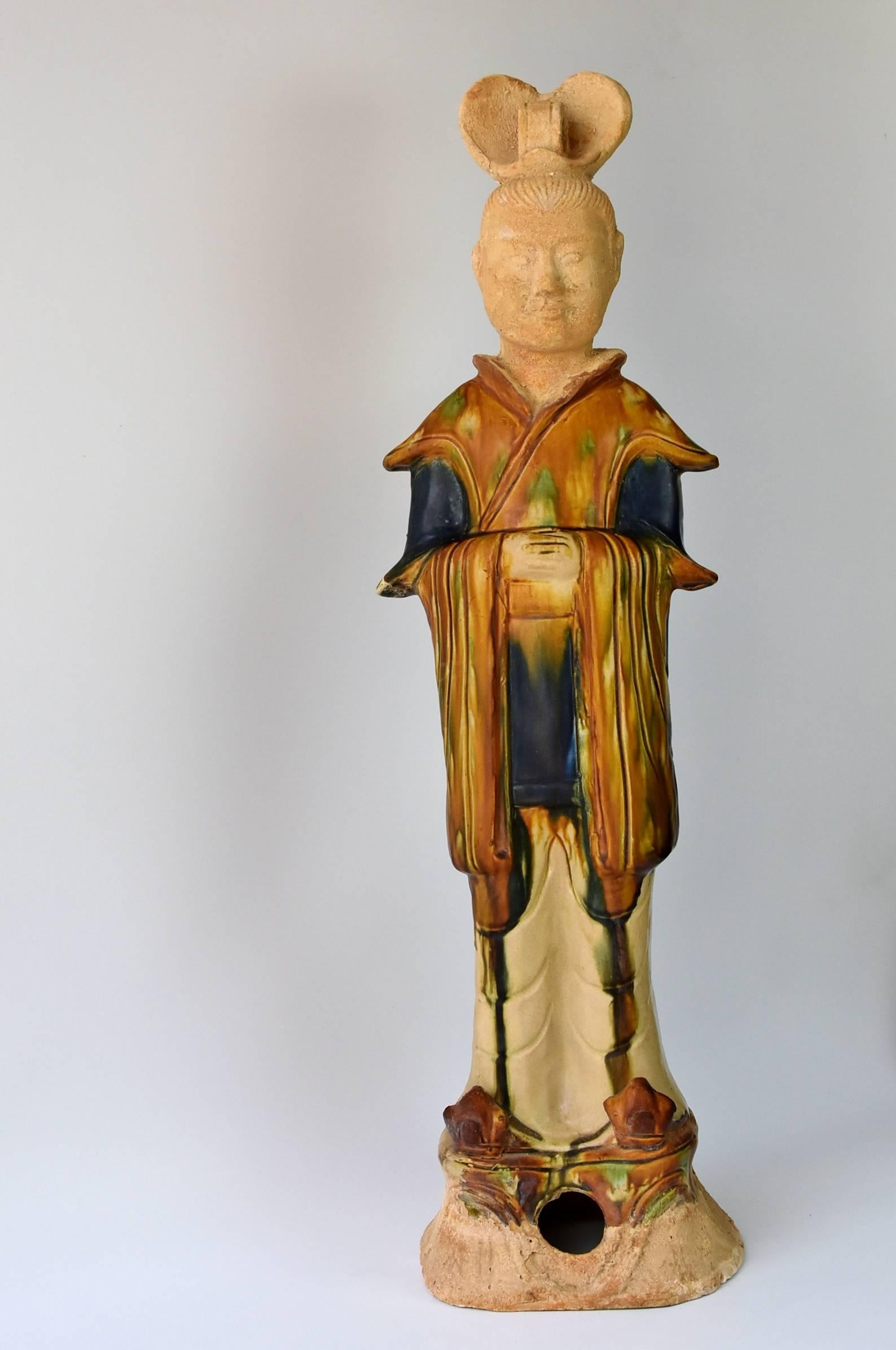 A beautiful, extra tall piece. The statue is of a tang dynasty court official. His robe and crown are beautifully done, using the Classic colors of caramel, blue and beige with green spots, the famed 