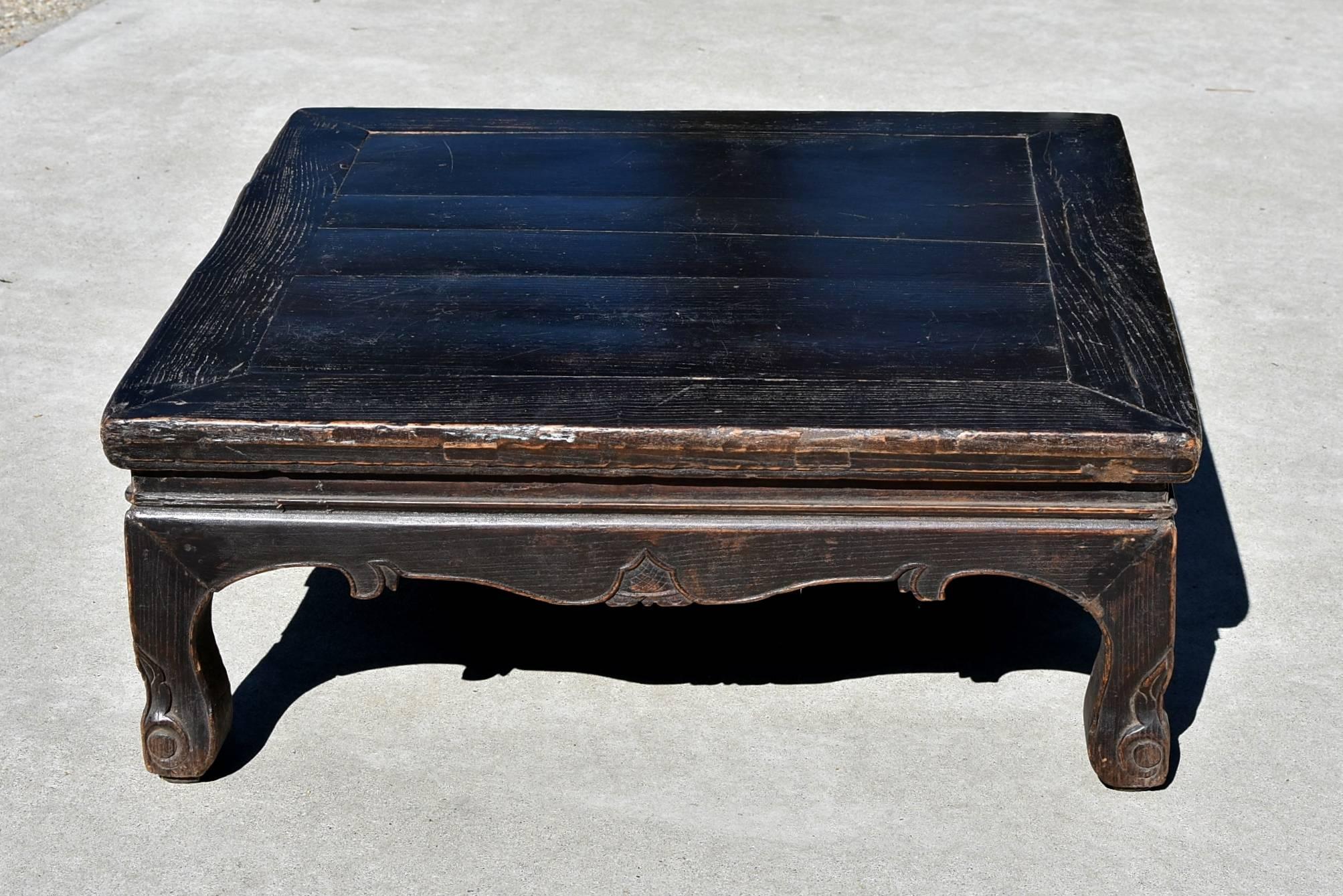 Beautiful 19th century Chinese table in solid wood. Such a piece is used in northern China on a structure called "Kang", a platform brick bed that is heated from underneath. In the northern extreme winters, Kang, is the place where most