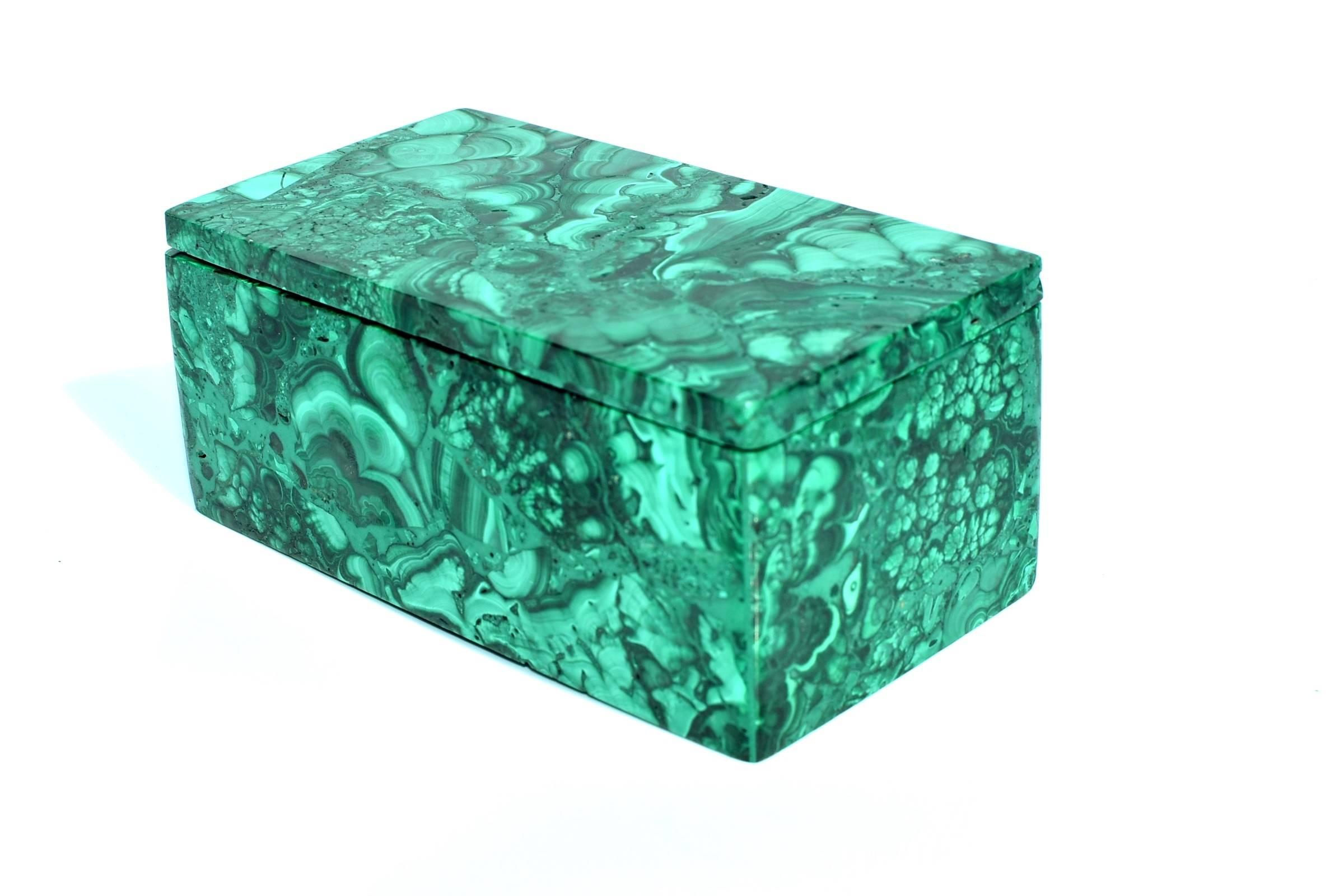 A spectacular malachite box. All natural with splendid swirls and patterns, this remarkable pieces is a sophisticated addition to your home.

Malachite is a stone of transformation, helping one achieve balance and spiritual evolution. It