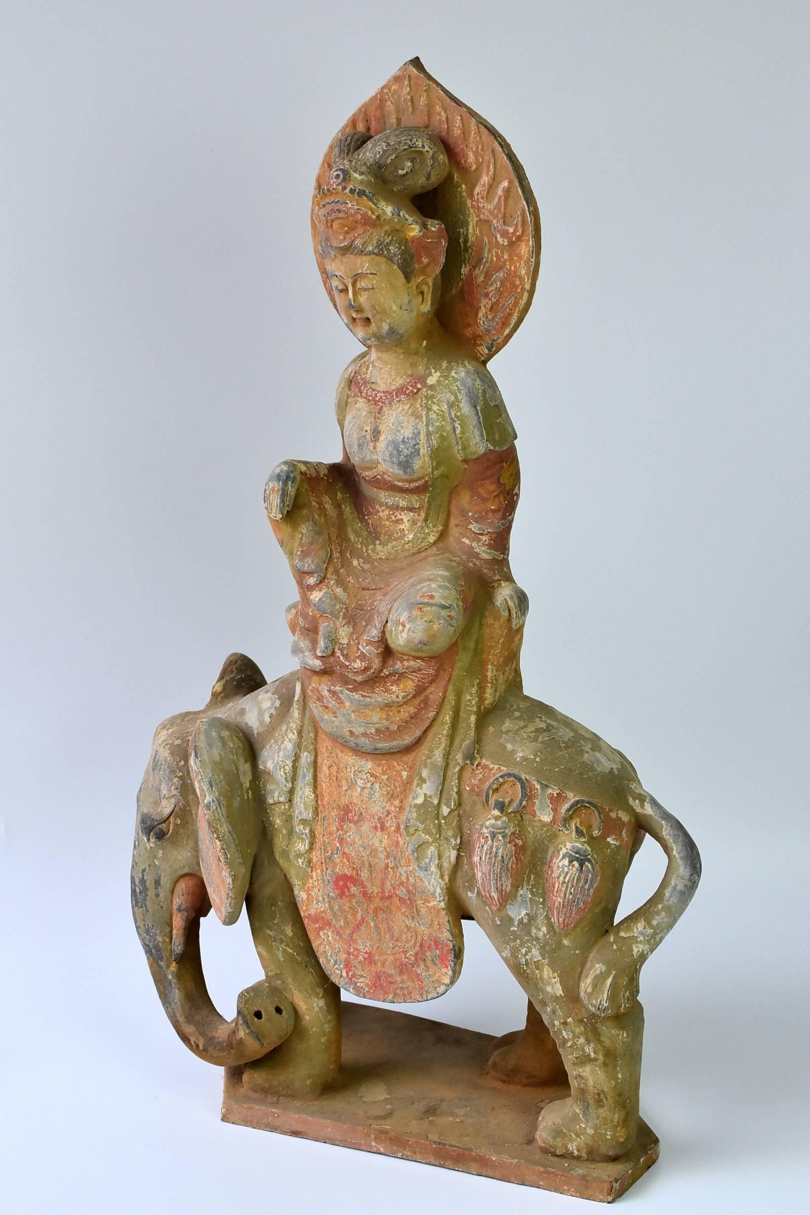 A fantastic terracotta piece featuring Bodhisattva Pu Xian on her elephant ride. Pu Xian, Samantabhadra, one of the four great Bodhisattva, is The Bodhisattva of Great Conduct, with the particular quality representing cultivation and practice using