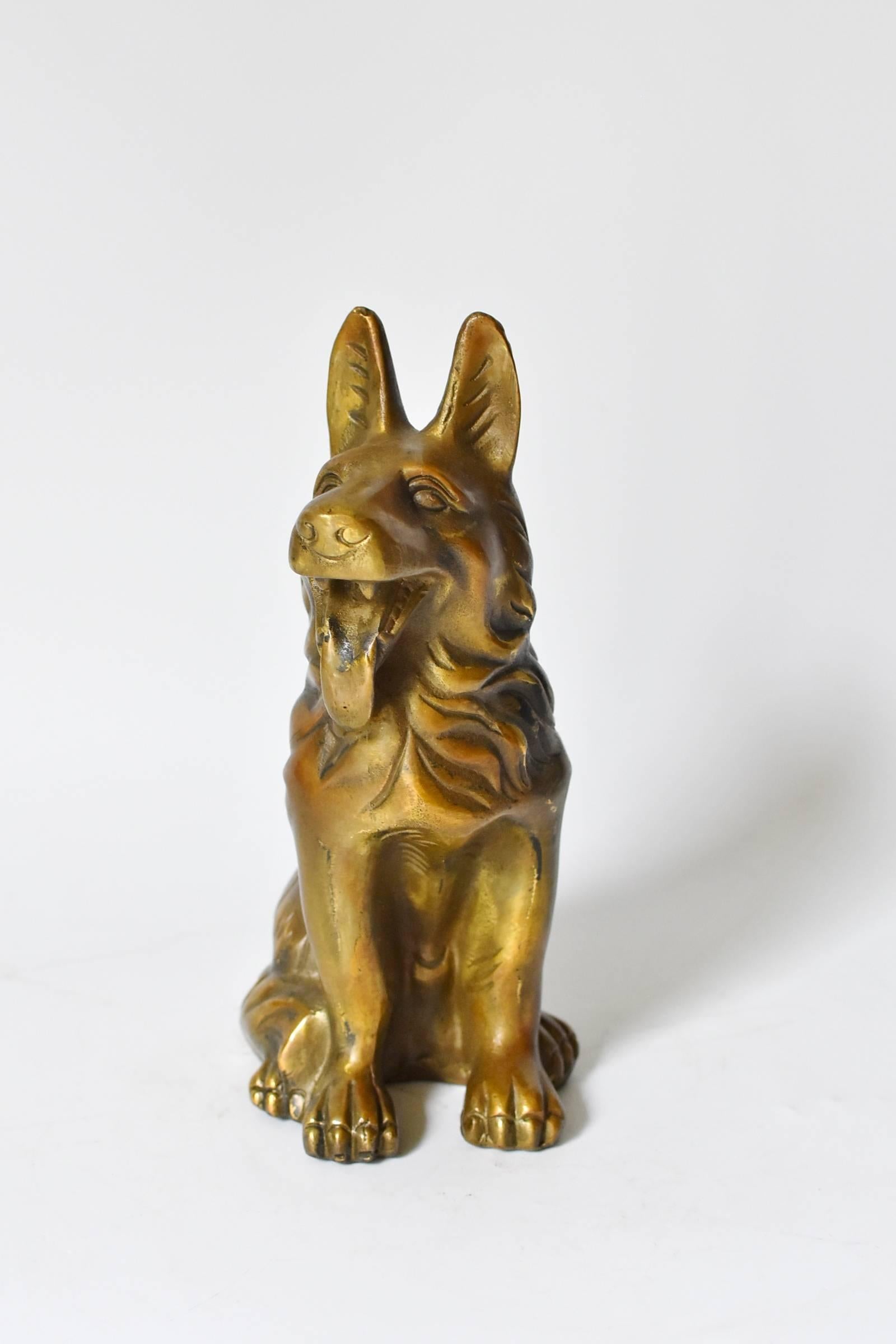 A wonderful brass dog, a German Shepherd. Vivid and expressive, with well defined facial features and hair. As a paperweight, or a sculpture, this is a fantastic piece to add to your collection.