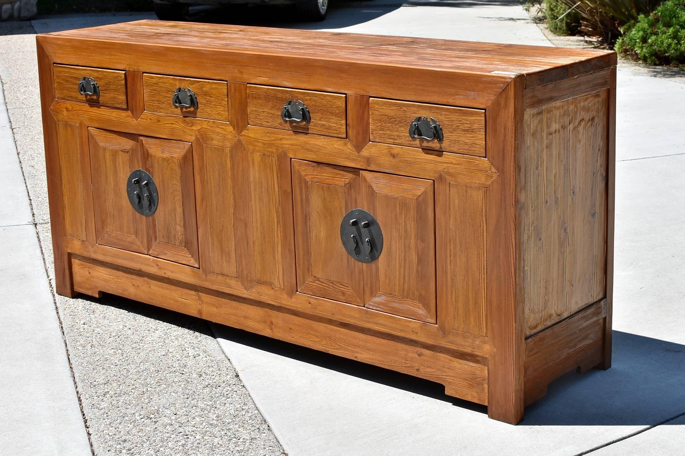 Beautiful chest is handmade using the best elmwood that showcases its amazing mountain-like grains. Four large drawers and compartments concealed by two pairs of doors offer ample storage. Handsome brass hardware enhances its timeless appeal. This